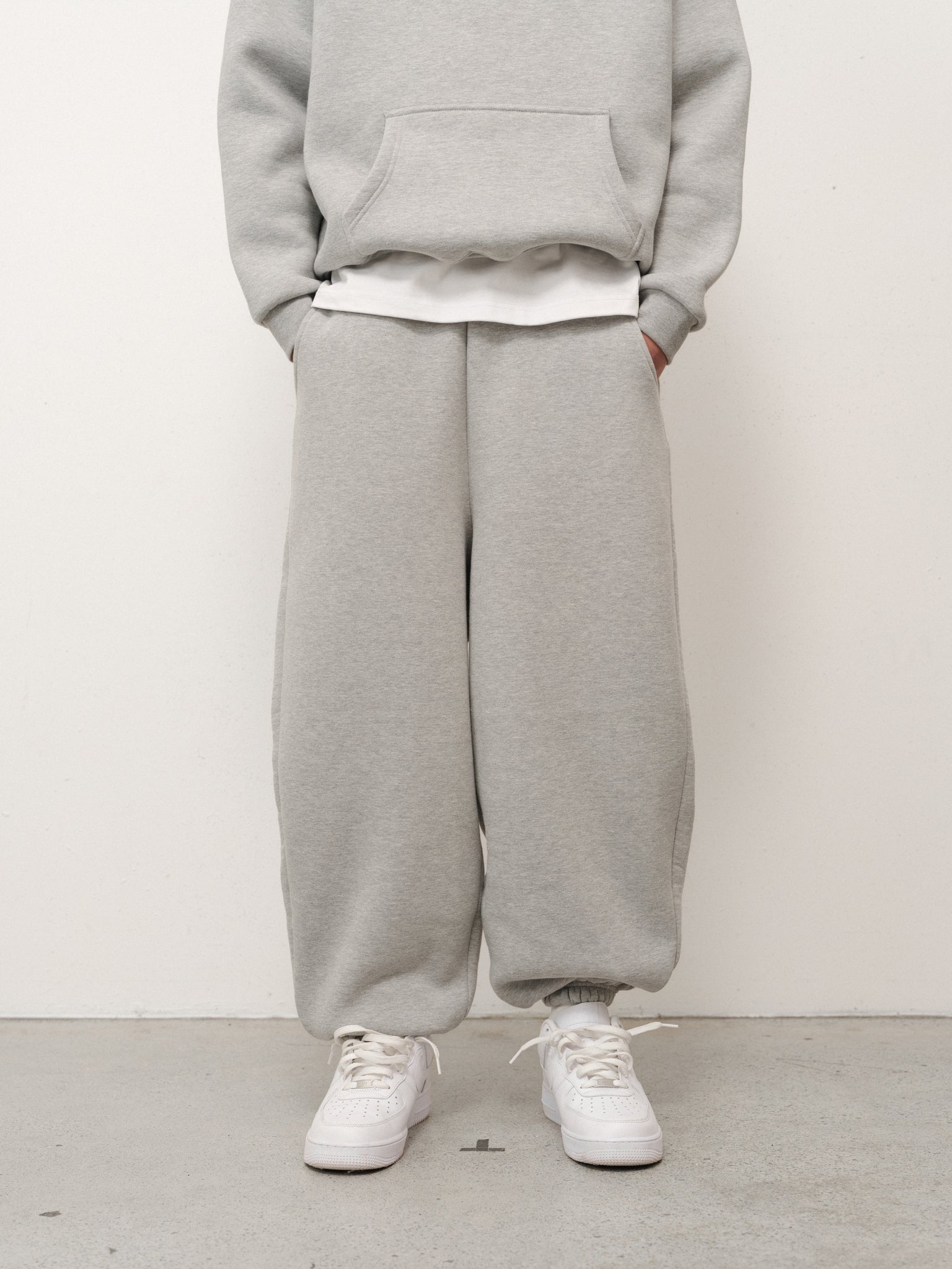 Gray Cozy Sweatpant by Sweats EU, relaxed fit with soft fabric, shown laid flat with drawstring waistband and cuffed ankles.