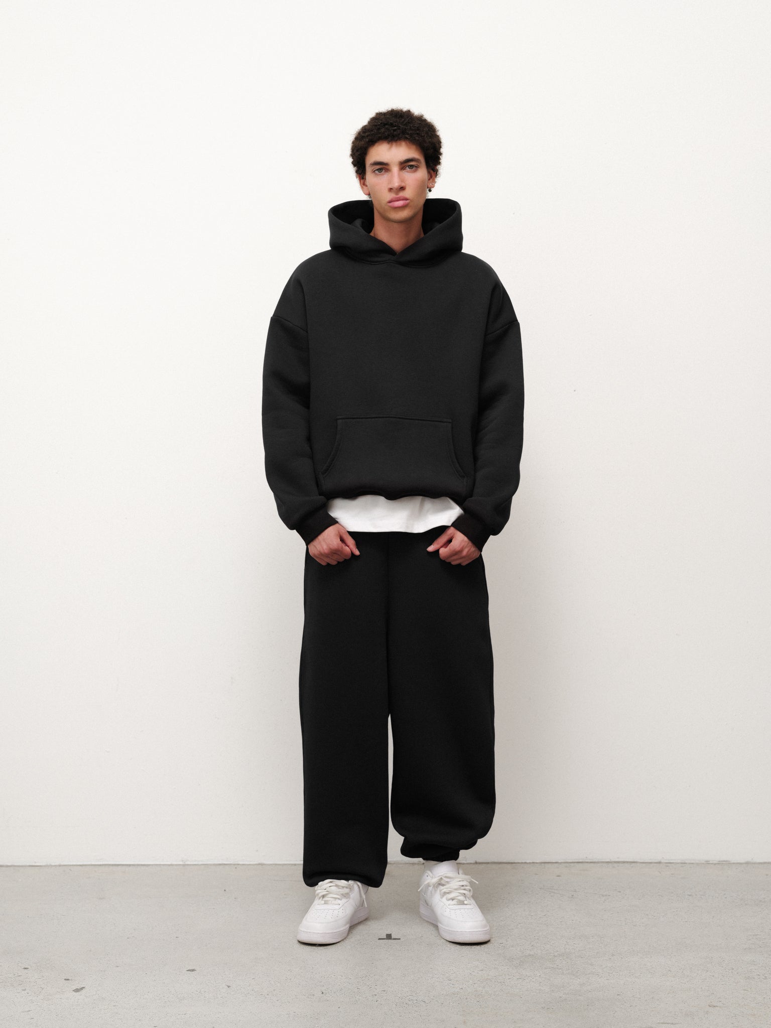 Black Cozy Sweatpant from Sweats EU, featuring a relaxed fit and soft fabric, displayed on a neutral background.