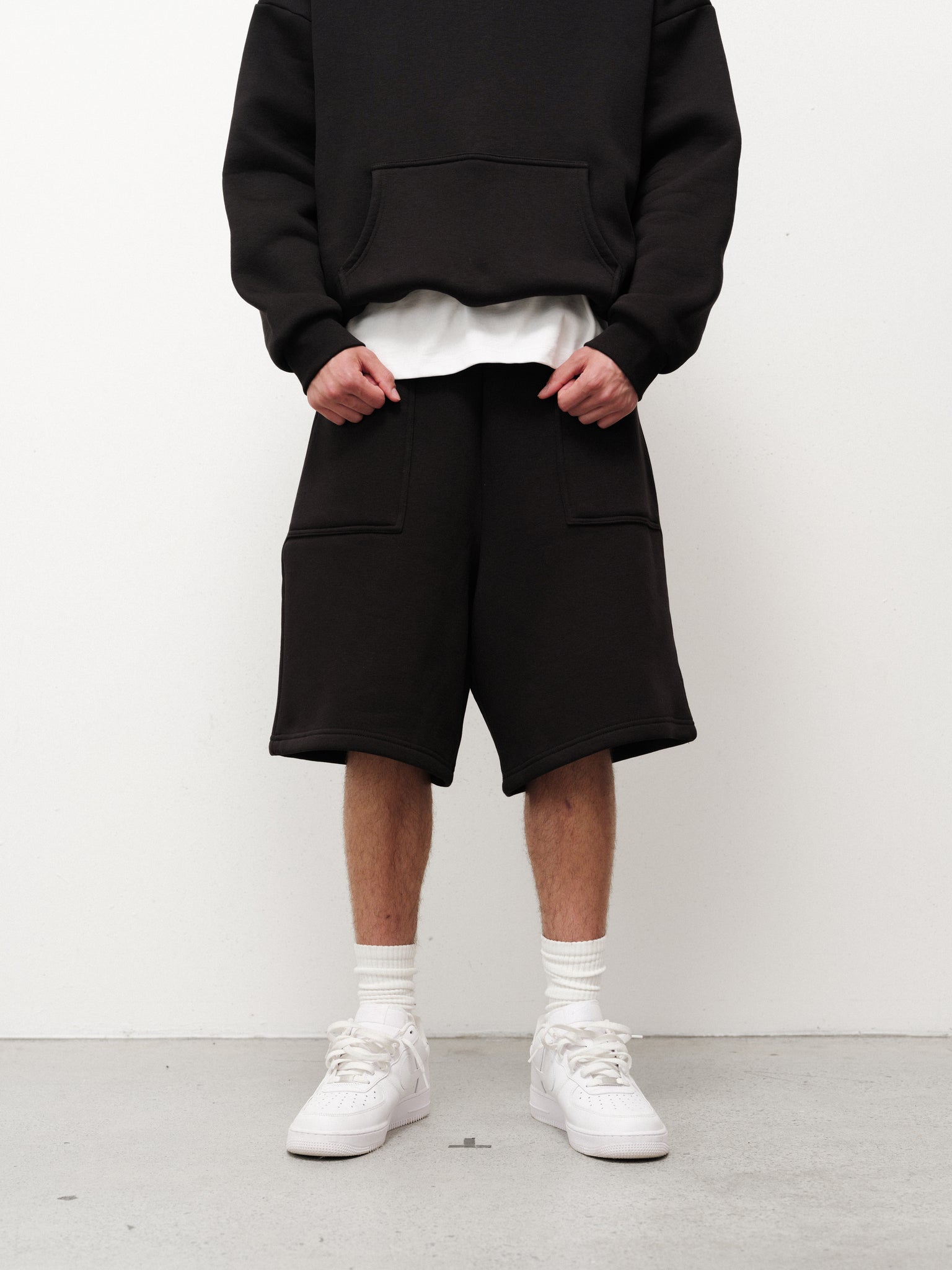 Black cozy shorts from Sweats EU, featuring a relaxed fit and soft fabric, perfect for comfortable casual wear.