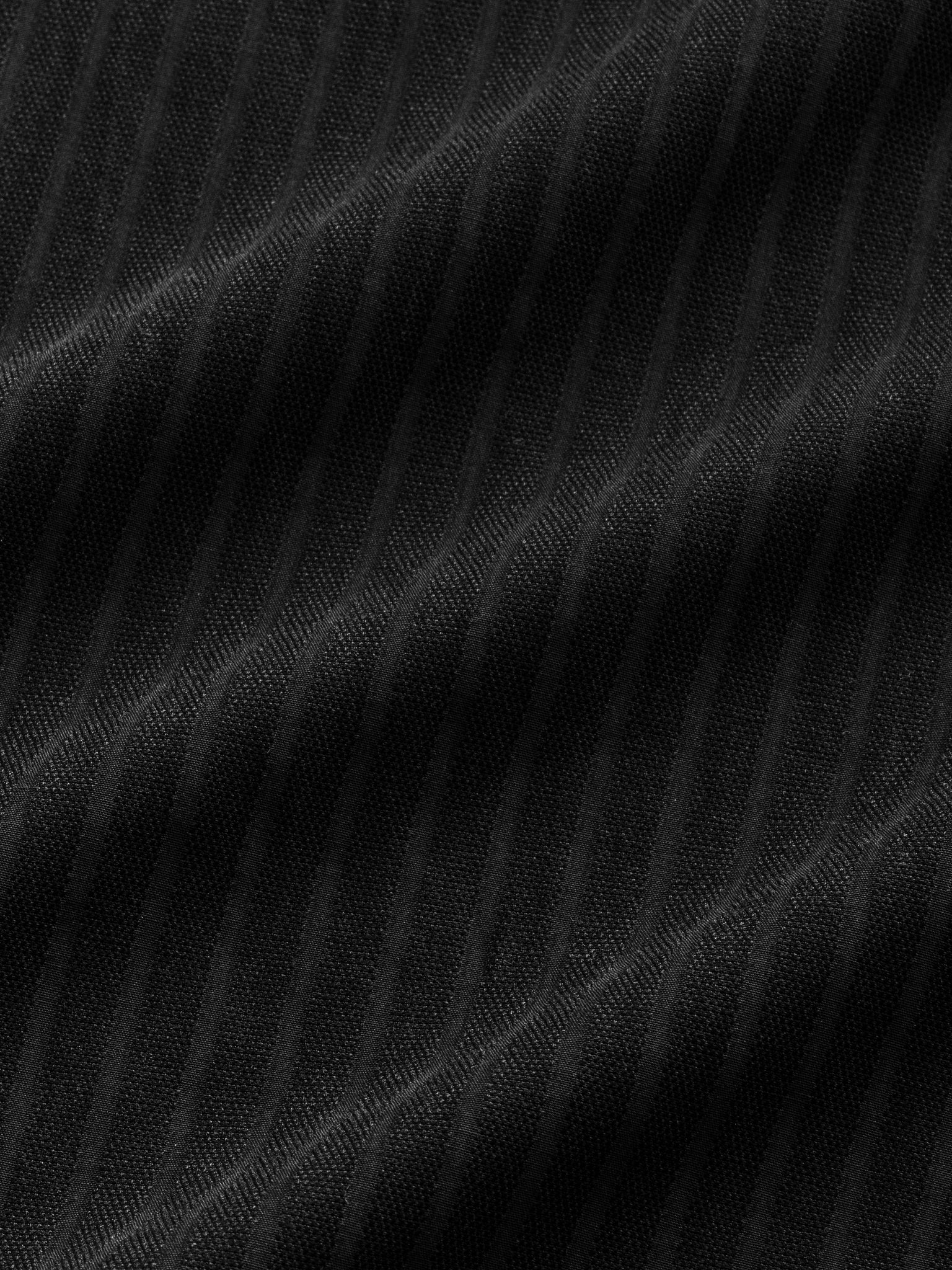 Black striped button-up shirt by SWEATS EU displayed flat with details of the fabric and pattern visible.