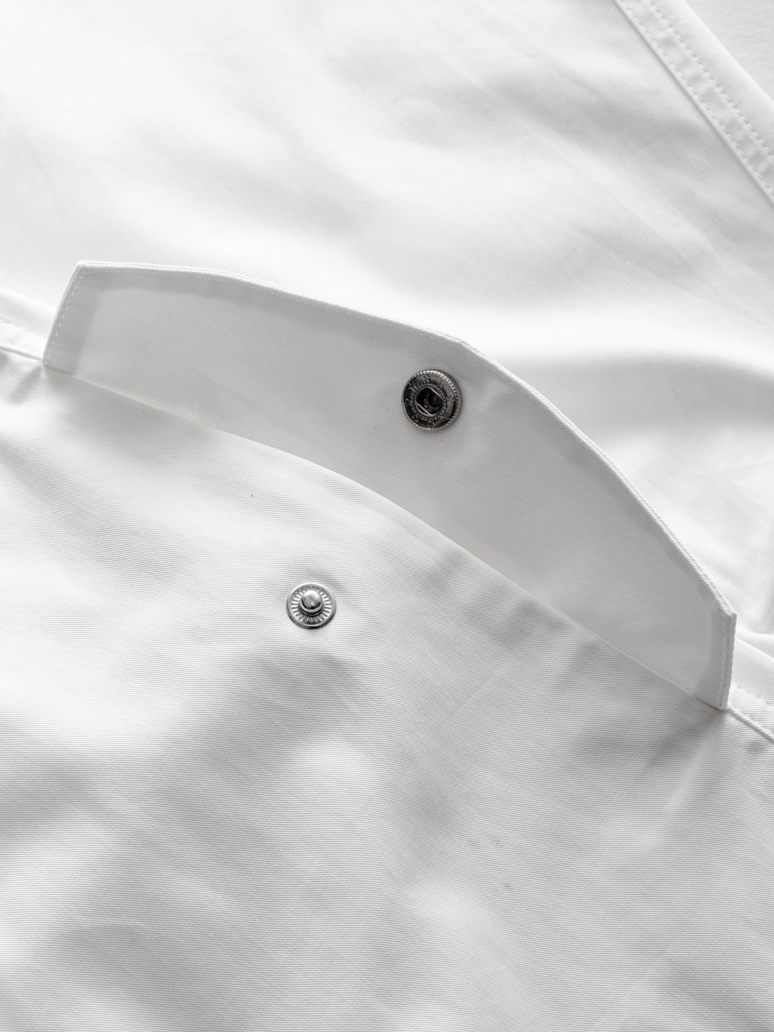 White V3 Flight Shorts by SWEATS EU laid flat, showing the lightweight fabric and athletic fit designed for active wear.