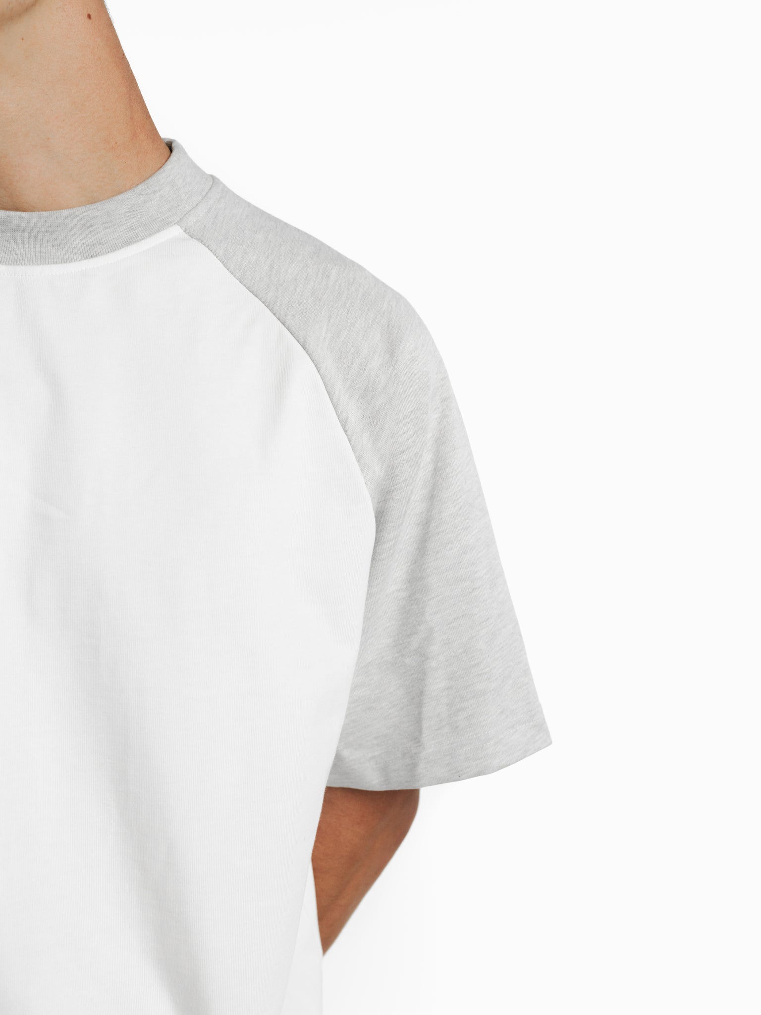 White raglan short-sleeve T-shirt from SWEATS EU featuring contrasting navy sleeves and a casual, sporty fit.