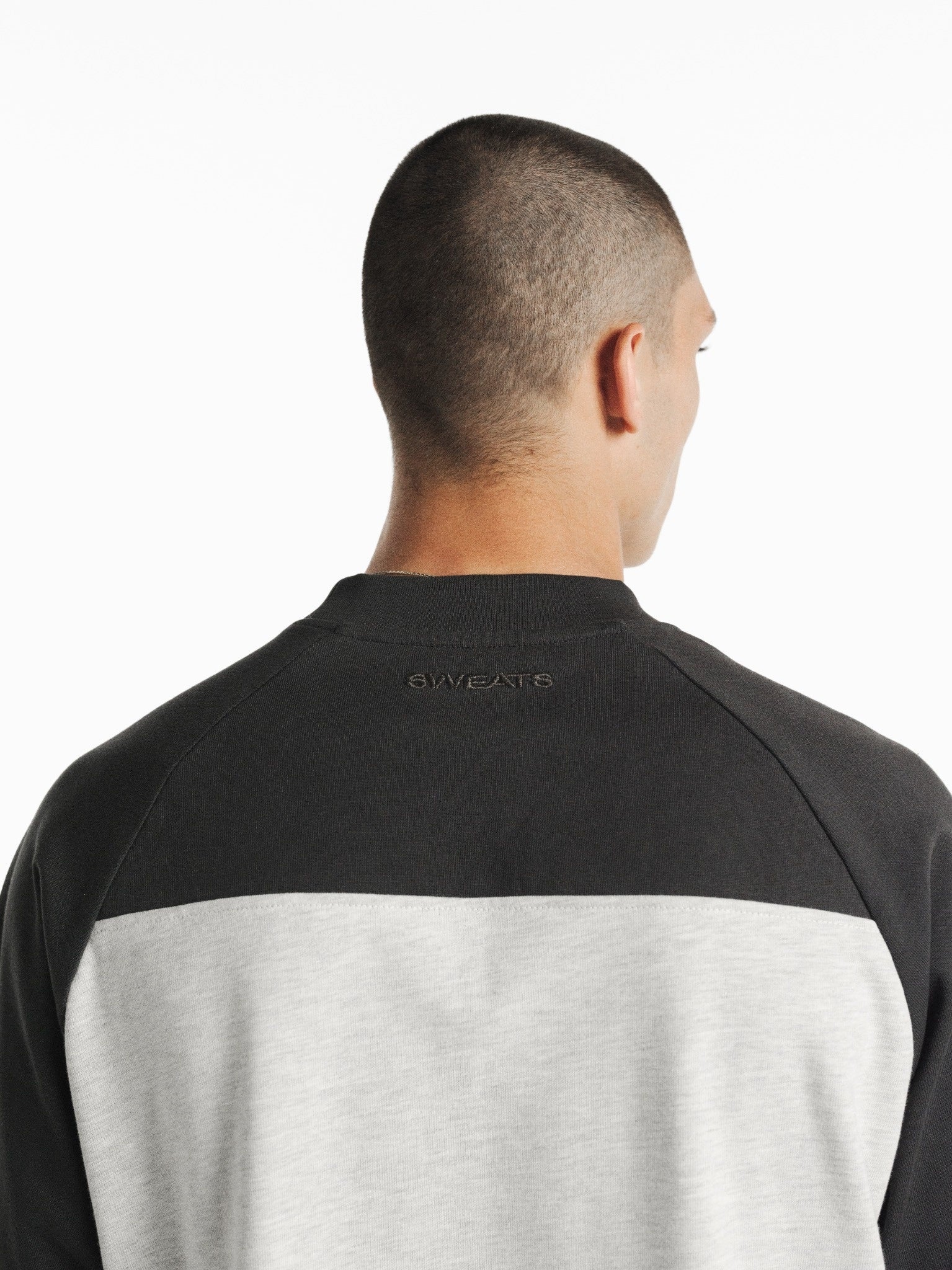 Light blue and gray raglan short-sleeve T-shirt from SWEATS EU in Arctic and Granite colors, displayed flat on a white background.
