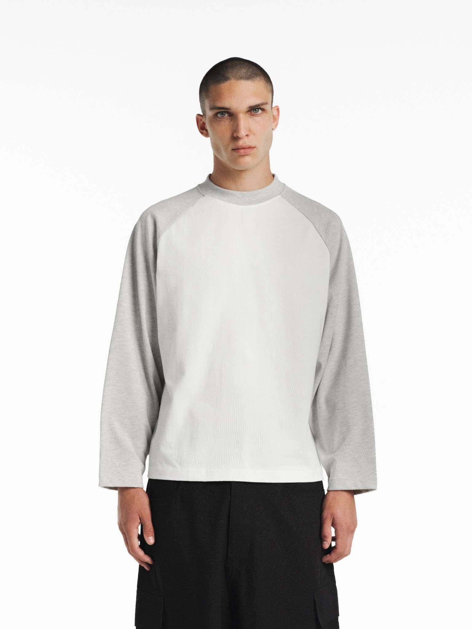 White and Arctic blue raglan long-sleeve T-shirt from SWEATS EU, featuring a casual fit and contrasting sleeve colors.