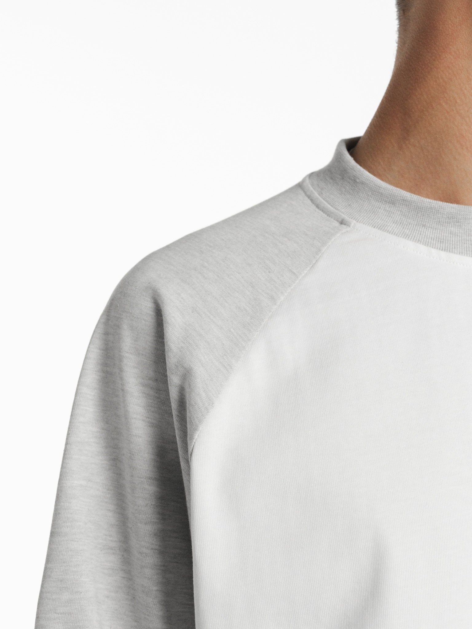 White and Arctic blue raglan long-sleeve T-shirt by SWEATS EU, showing the casual fit and color block design.