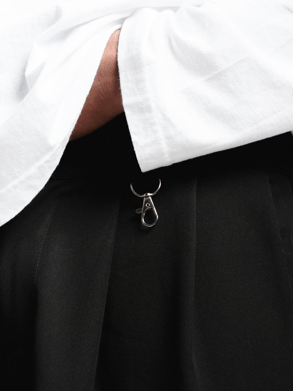 Black pleated pants from Sweats EU, showcasing a stylish, tailored design with crisp pleats and a modern fit.
