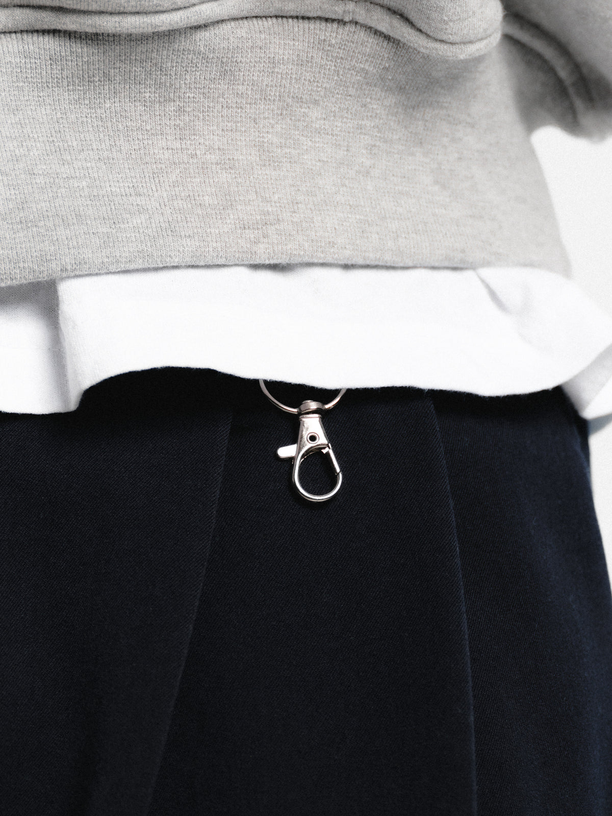 Navy pleated shorts by Sweats EU, featuring a stylish design with pleats and a comfortable fit, shown on a model.