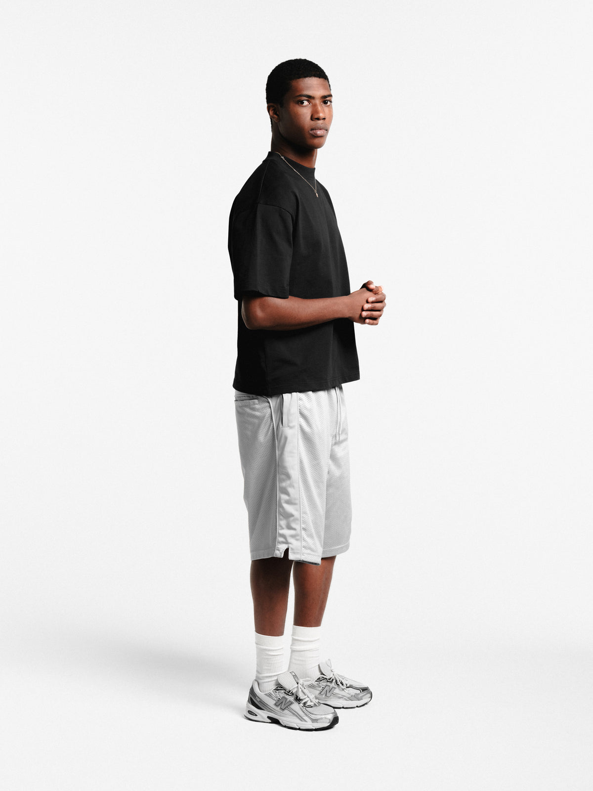 Grey mesh shorts by SWEATS EU, featuring lightweight fabric and sporty design, perfect for active wear and casual outfits.