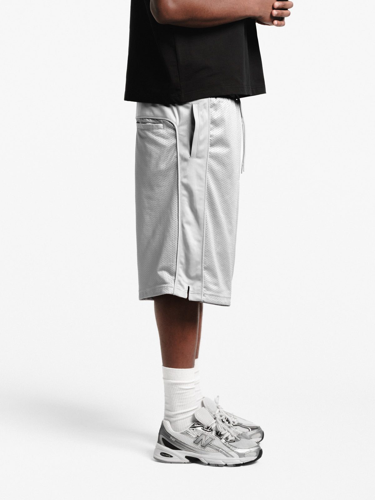 Grey mesh shorts by SWEATS EU featuring lightweight fabric and an athletic design for active wear.
