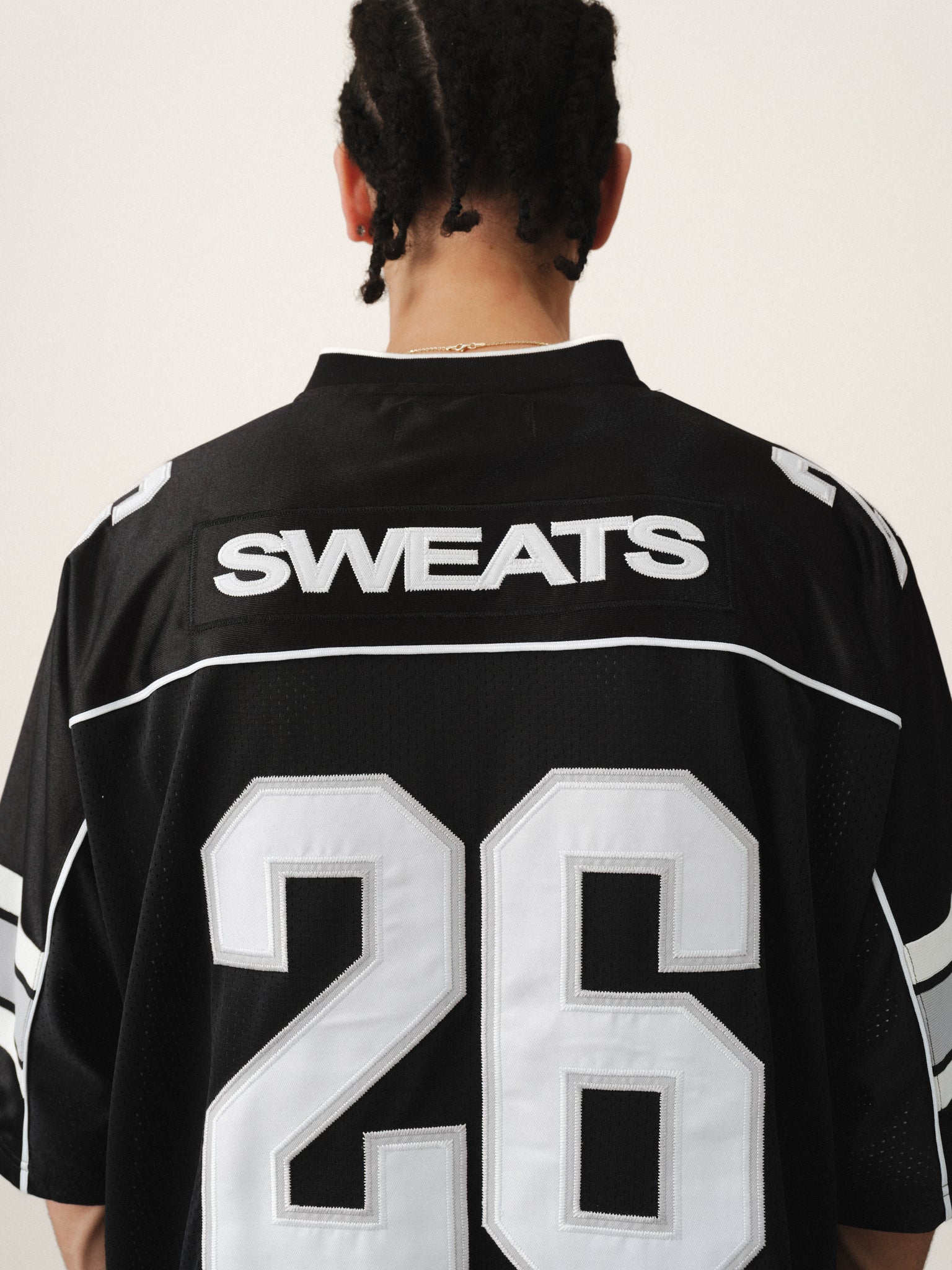 Black Signature Jersey by Sweats EU, showcasing a stylish summer-inspired athletic jersey with a sleek design and breathable fabric.
