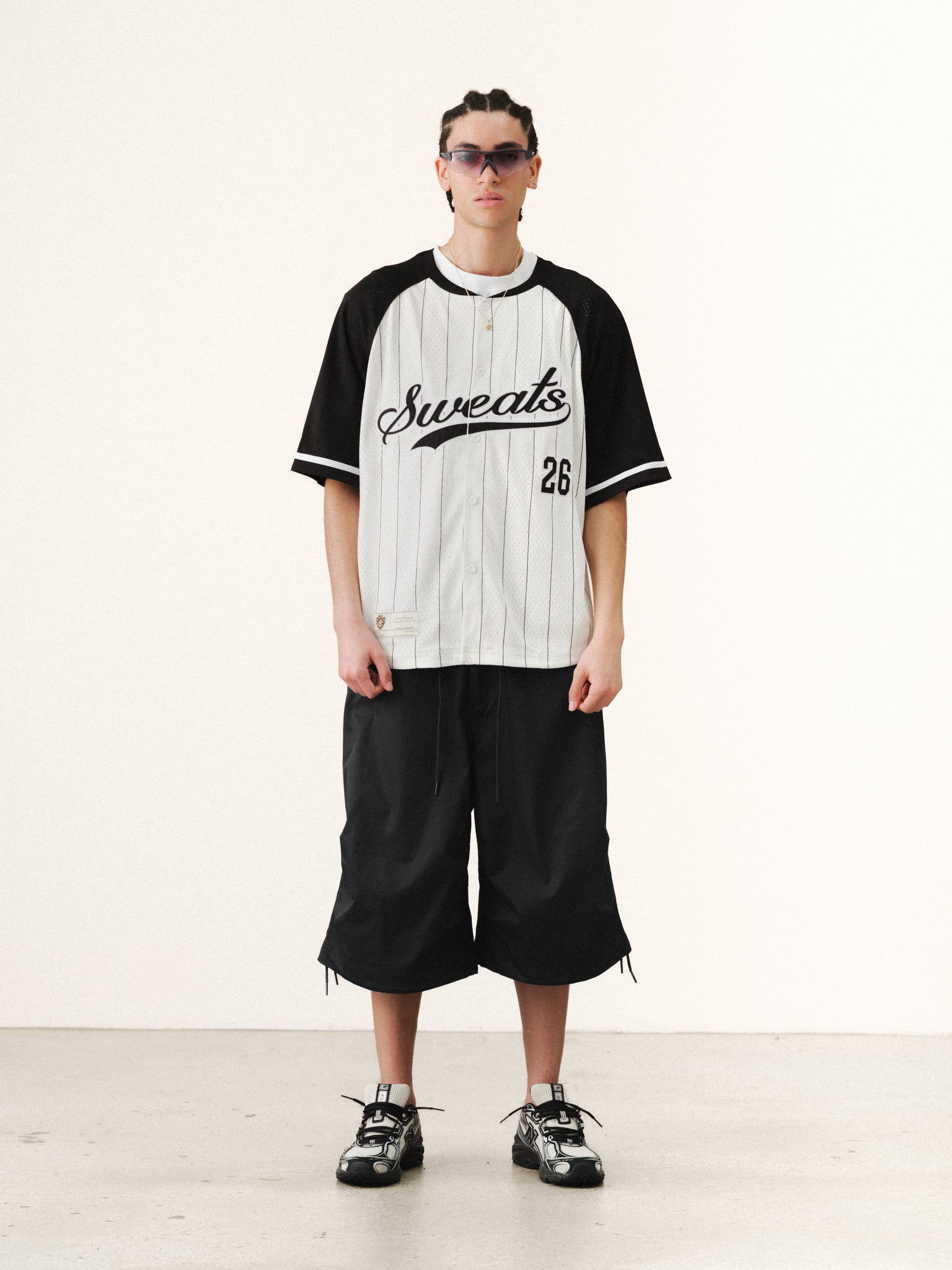 White and navy pinstripe baseball jersey by SWEATS EU, featuring classic button-up style and team-inspired design.