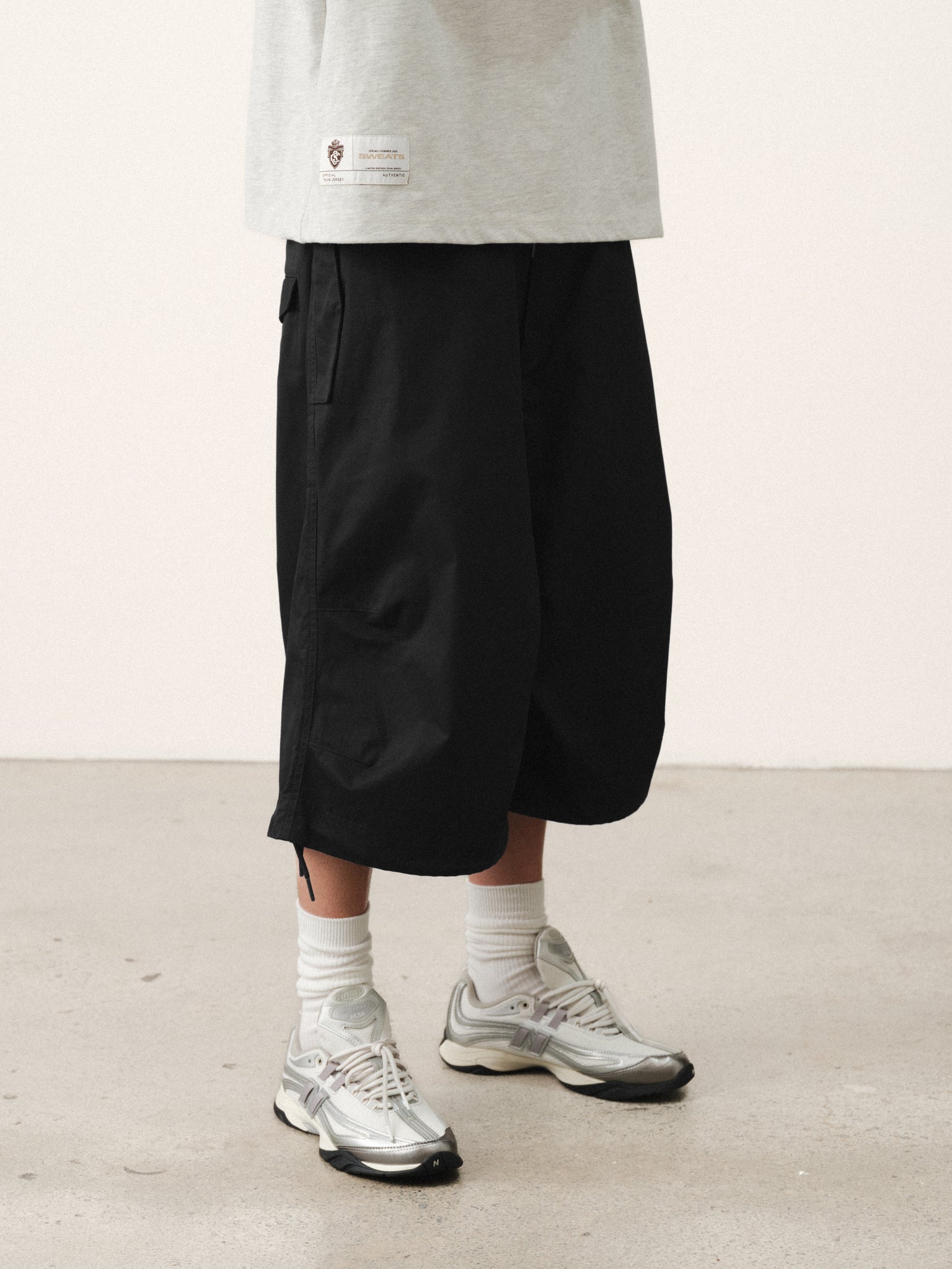 Black V3 Flight Shorts by SWEATS EU, showing a close-up of the lightweight athletic shorts with a sleek design.