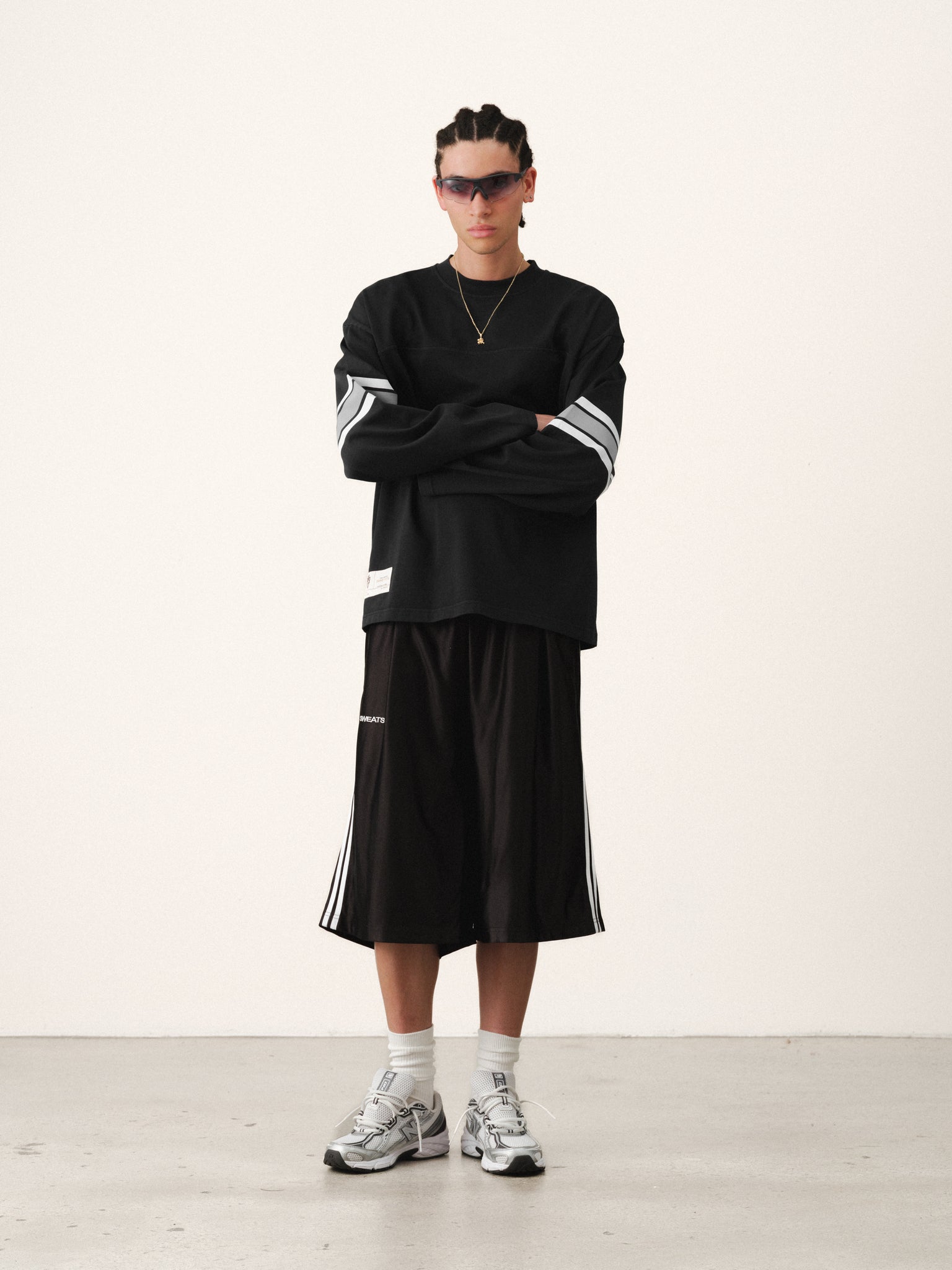 Washed black long-sleeve jersey T-shirt by SWEATS EU, shown flat with soft fabric and classic fit.