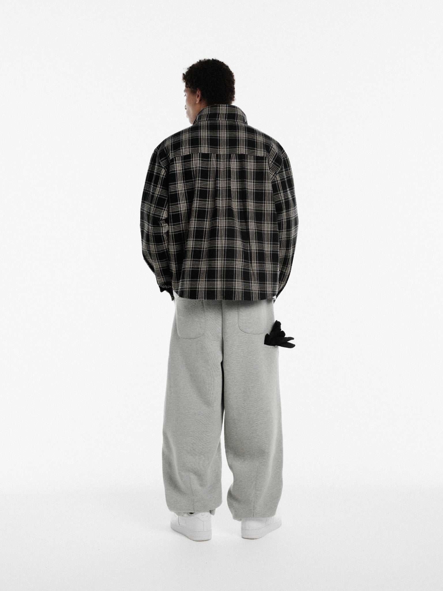 Black flannel long-sleeve shirt by SWEATS EU, showing the soft fabric and classic button-up design.