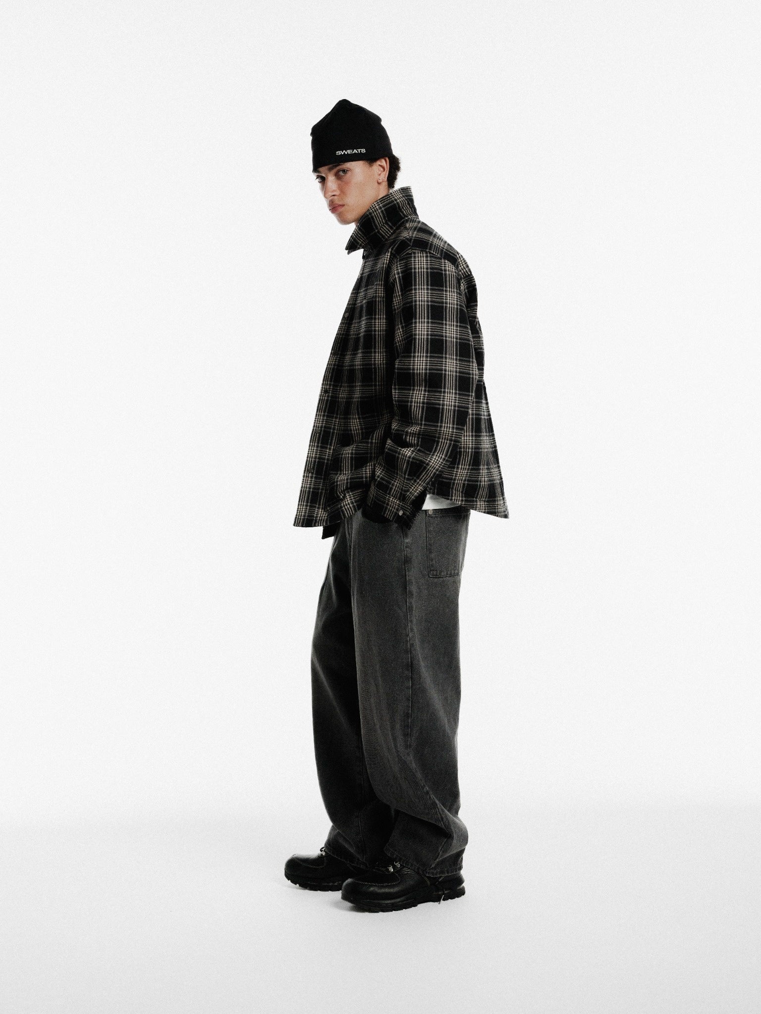 Black flannel jacket by Sweats EU, featuring a cozy, button-up design with a classic collar and relaxed fit.