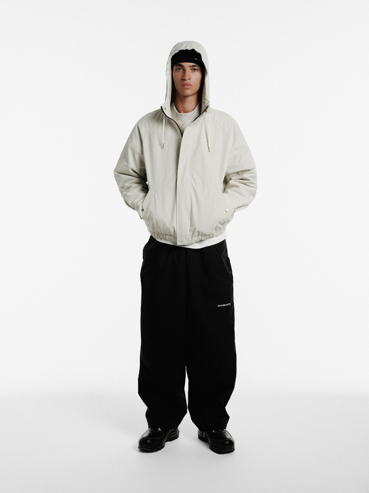 Stone-colored ARC Jacket by SWEATS EU, showcasing a stylish winter jacket with a modern fit and durable fabric.