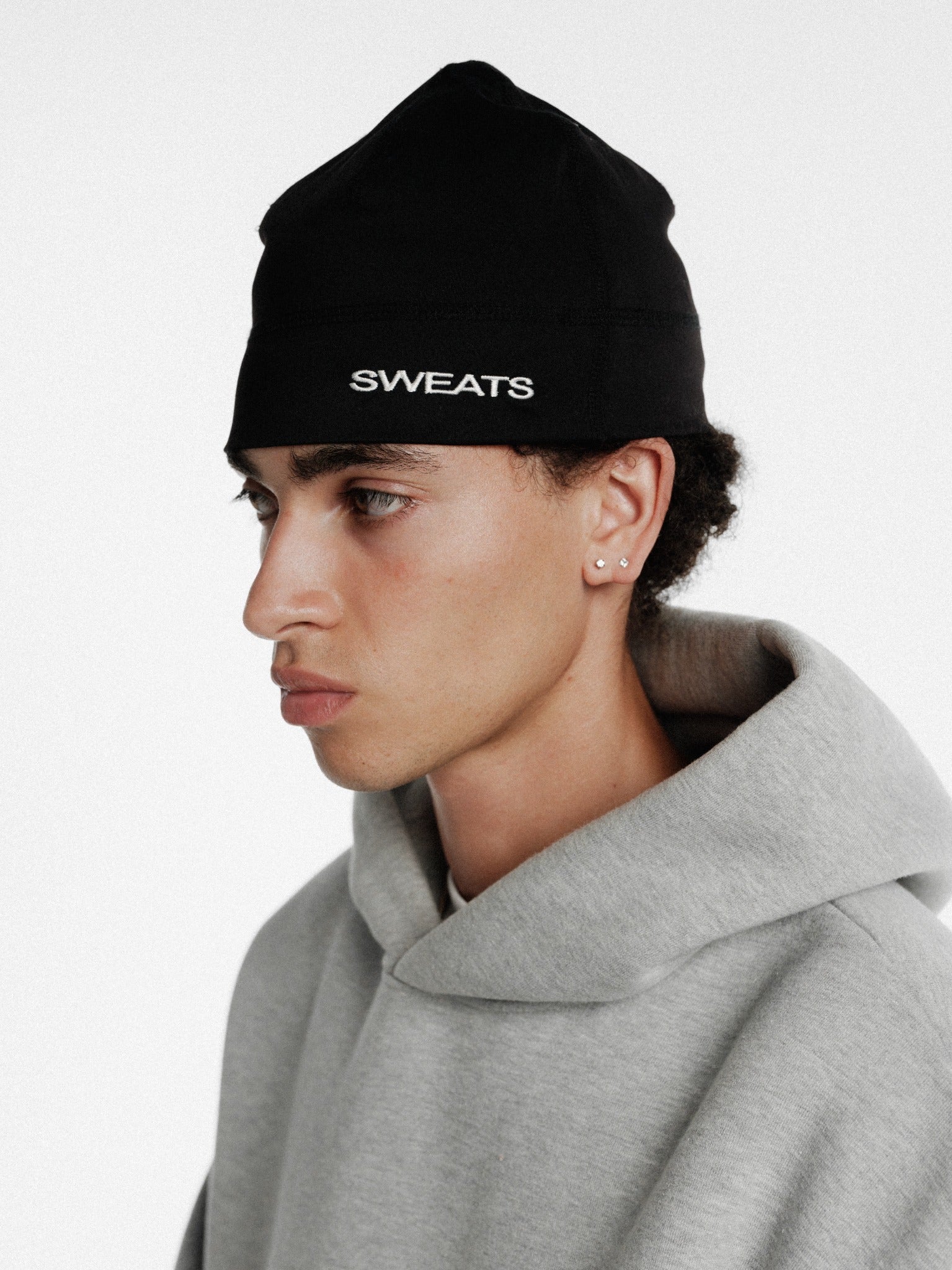 Black SportsSkully by Sweats EU featuring a snug, comfortable winter headwear design with a sleek, sporty look.