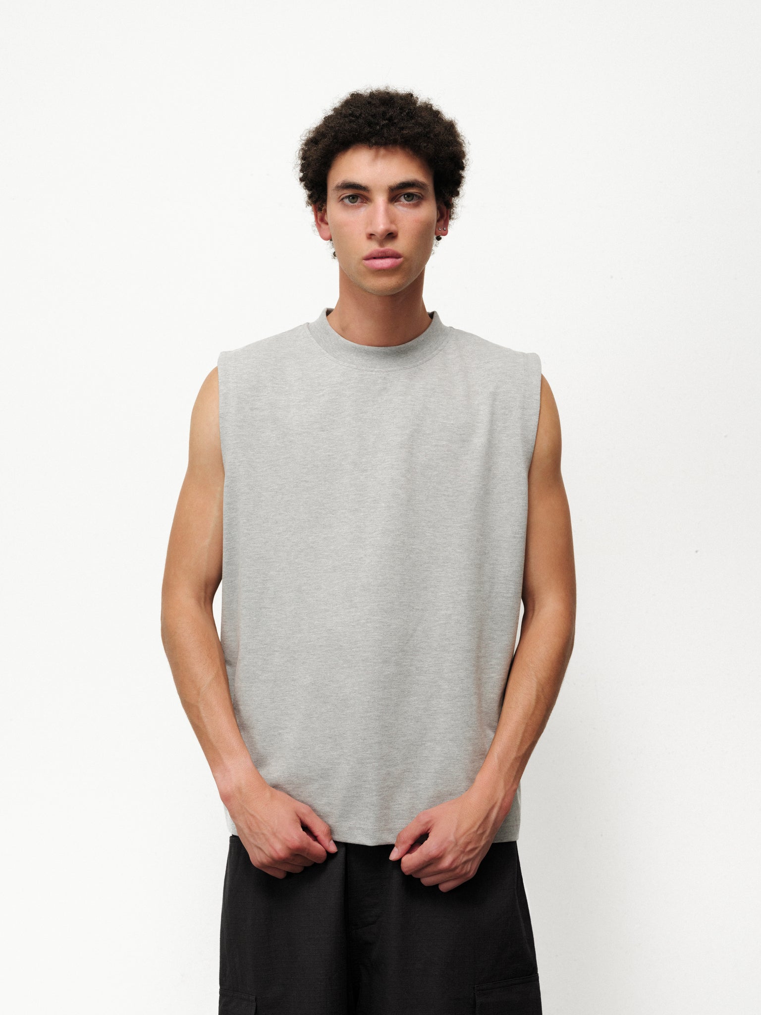 Gray Melange Muscle Tee by SWEATS EU, front view showing sleeveless design and relaxed fit.