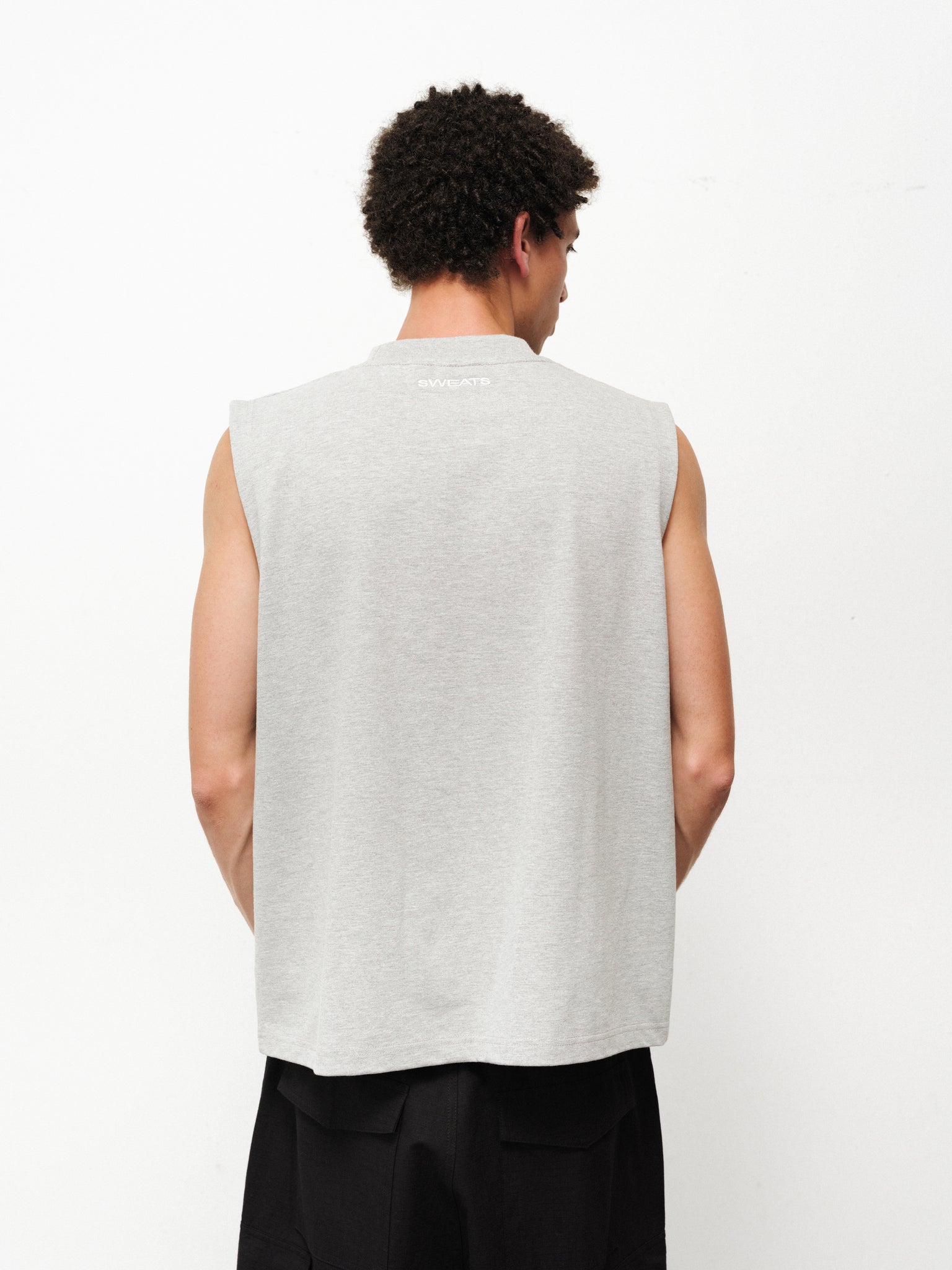 Grey Melange Muscle Tee by SWEATS EU displayed on a model, featuring a relaxed fit and sleeveless design for casual wear.