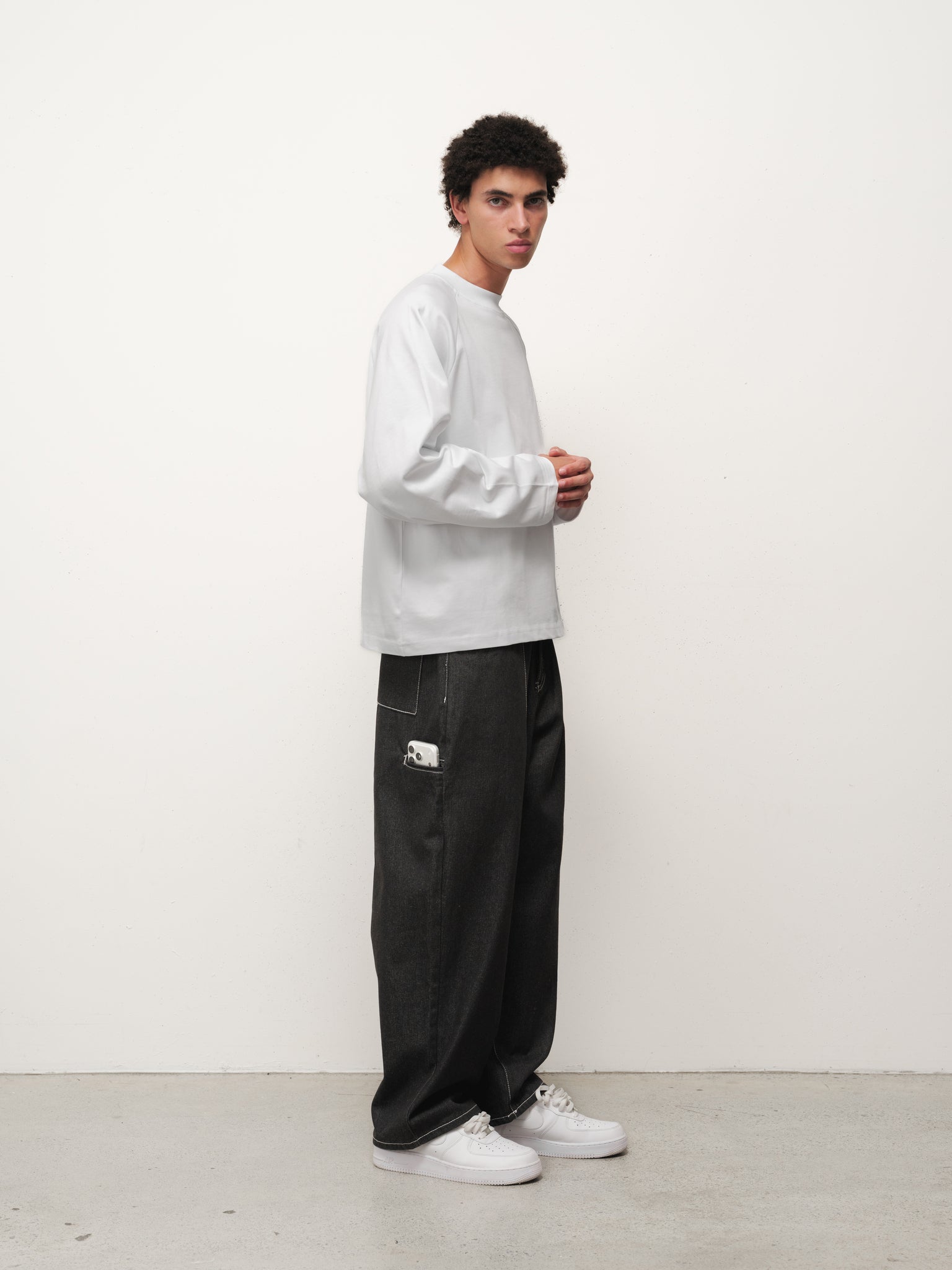 White long sleeve T-shirt by Sweats EU displayed on a model, showcasing a casual and comfortable fit.