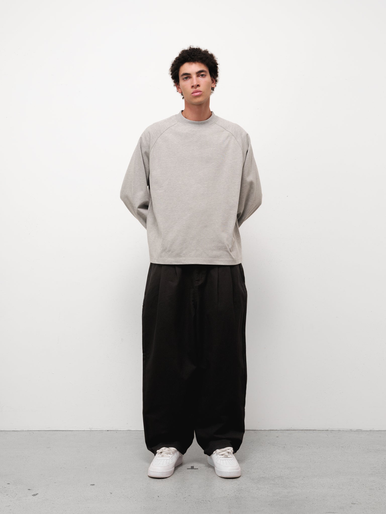 Grey long sleeve T-shirt from Sweats EU, showing front view with fitted design and soft fabric texture.
