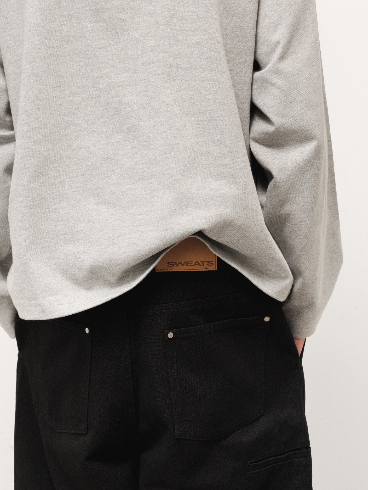 Grey long sleeve T-shirt from Sweats EU, shown flat with detailed fabric texture and neckline, casual and comfortable style.