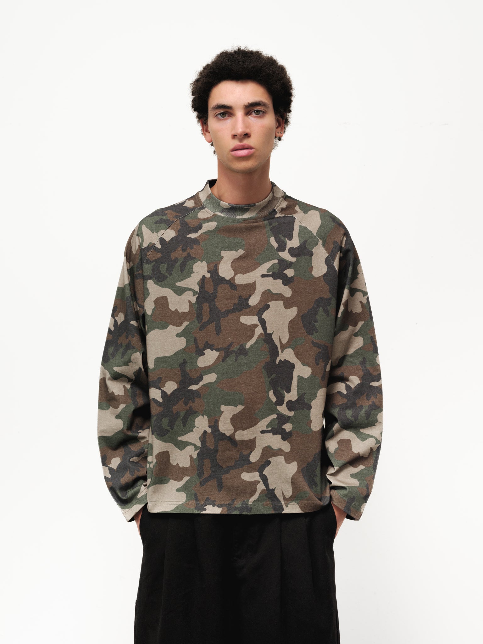 Long sleeve camo T-shirt by SWEATS EU displayed on a model in a full stock shoot.
