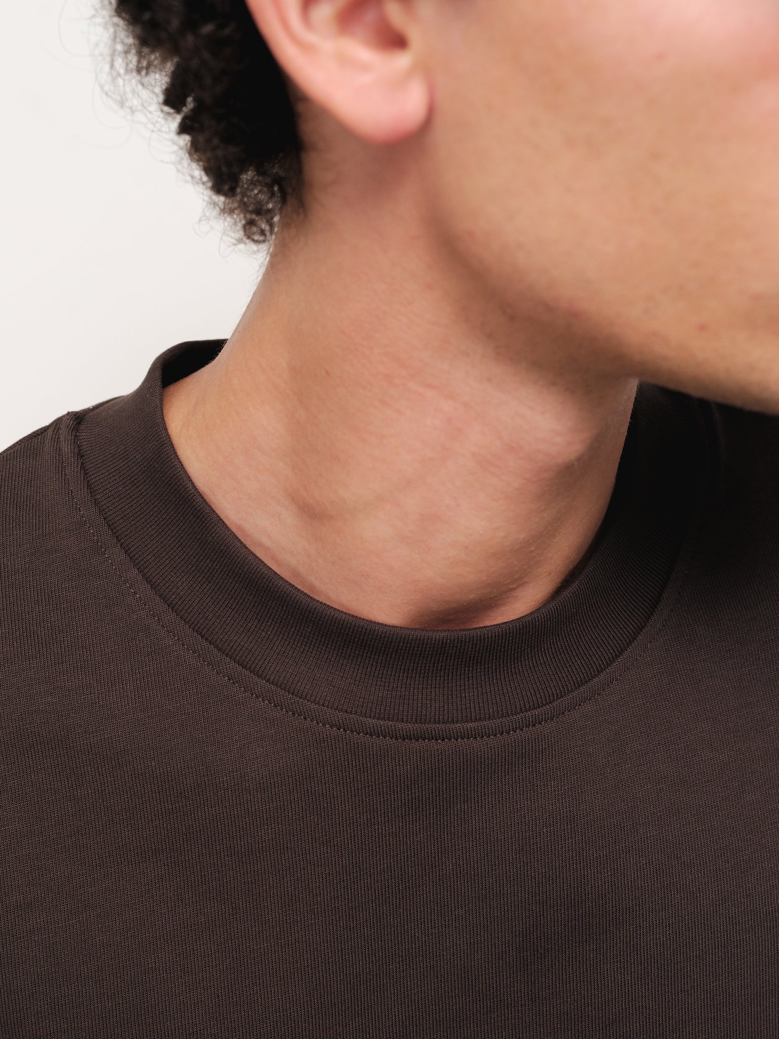 Sweats EU Signature Blank Coffee T-shirt displayed on a model, showcasing a casual fit and classic design.