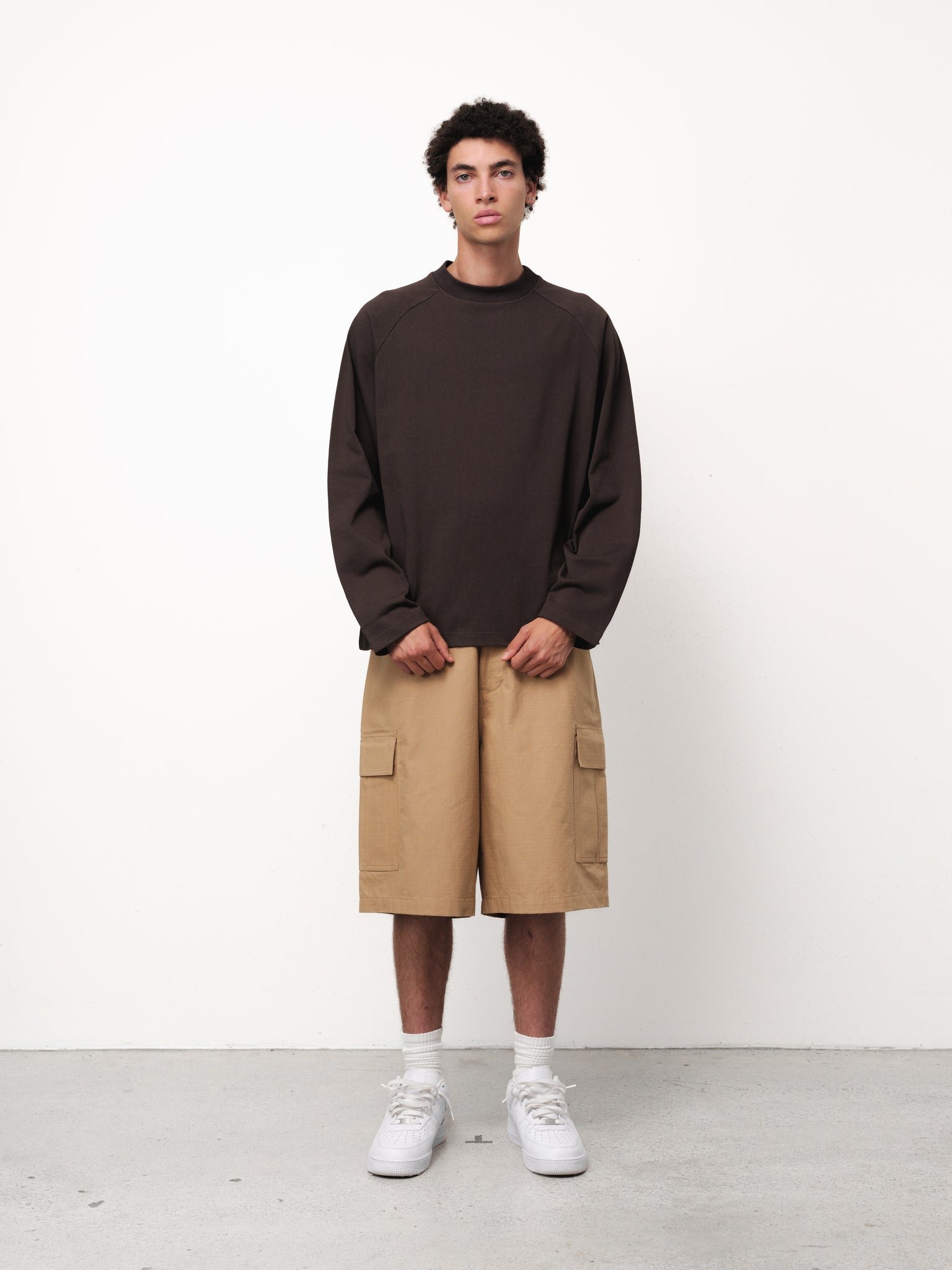 Long sleeve coffee-colored T-shirt by Sweats EU displayed on a model, featuring a casual fit and soft fabric.