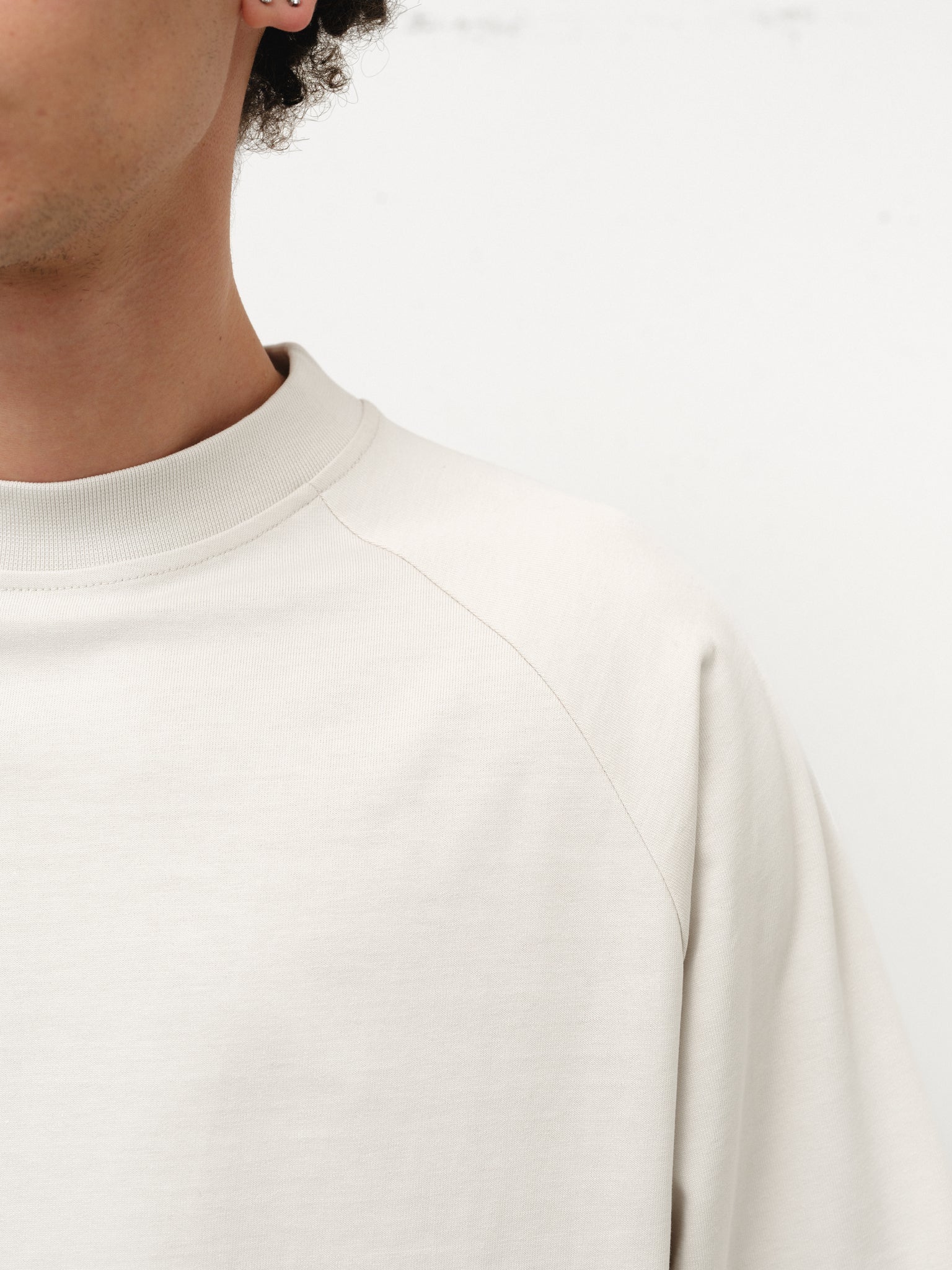 Long sleeve chalk T-shirt by SWEATS EU displayed on a model, showcasing casual fit and soft fabric.