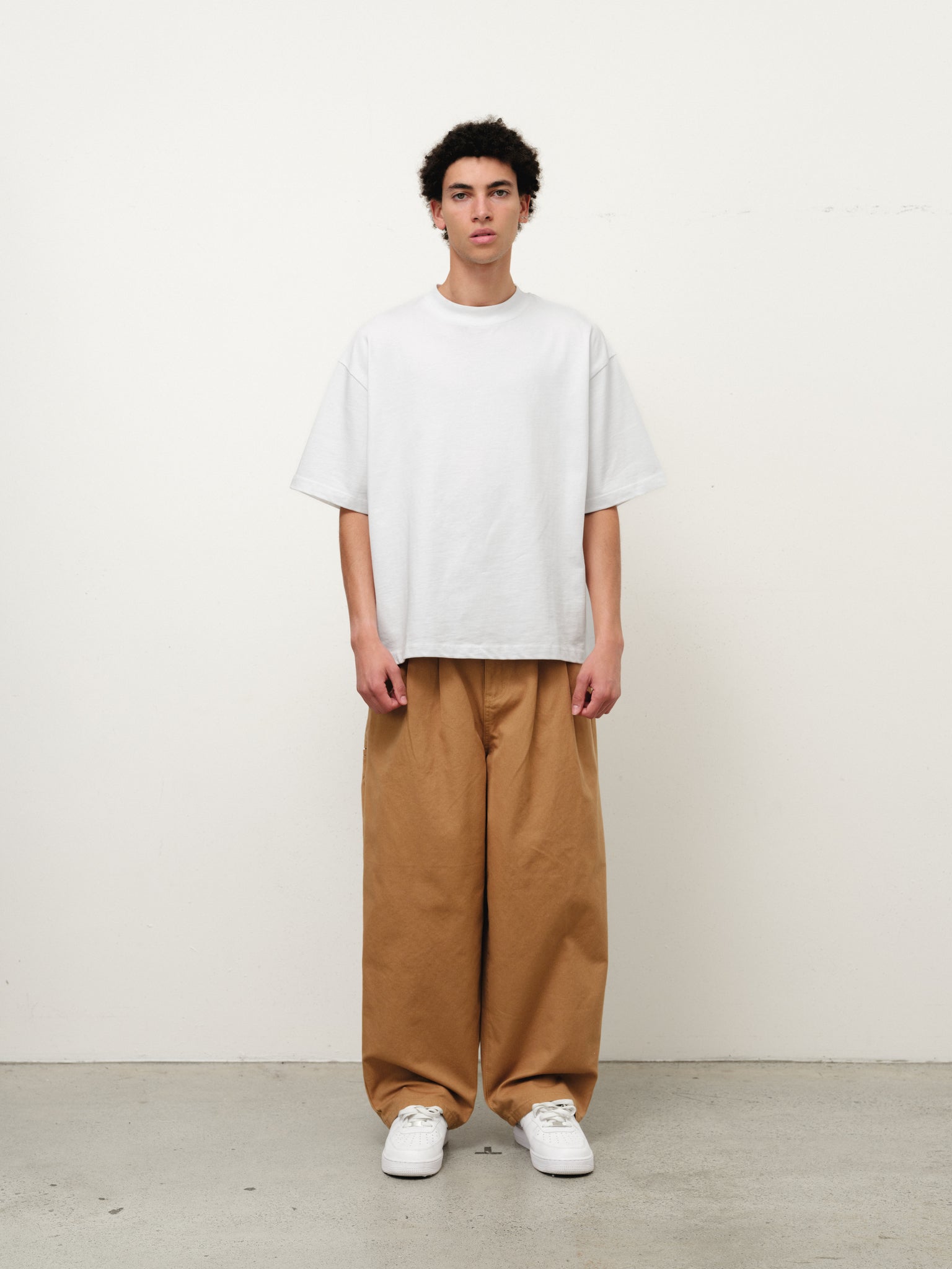Tan workwear pants by SWEATS EU displayed on a full stock shoot, showcasing durable fabric and practical design.