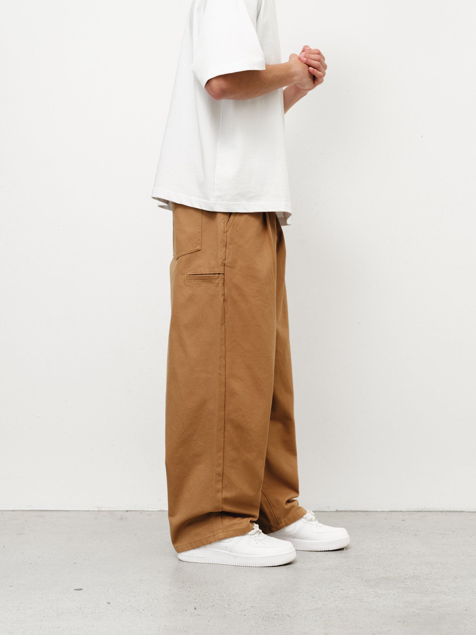 Tan workwear pants by SWEATS EU, full-length view showing durable fabric and classic fit for industrial or casual use.