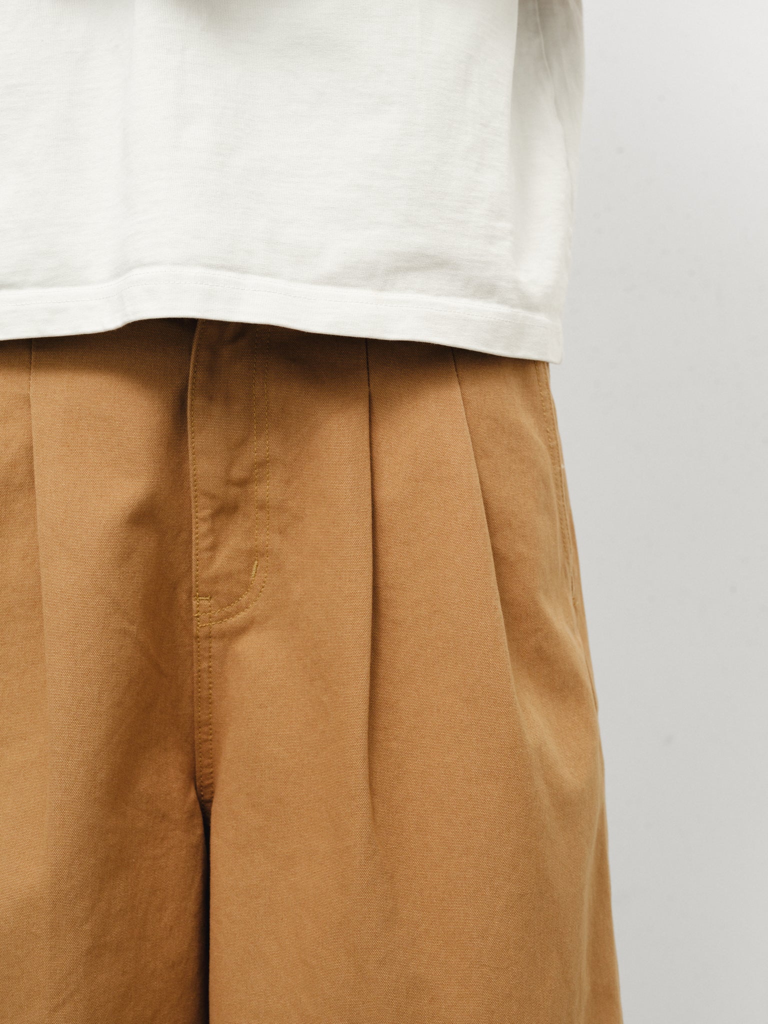 Tan workwear shorts by SWEATS EU, featuring durable fabric and a practical fit for industrial or casual work settings.