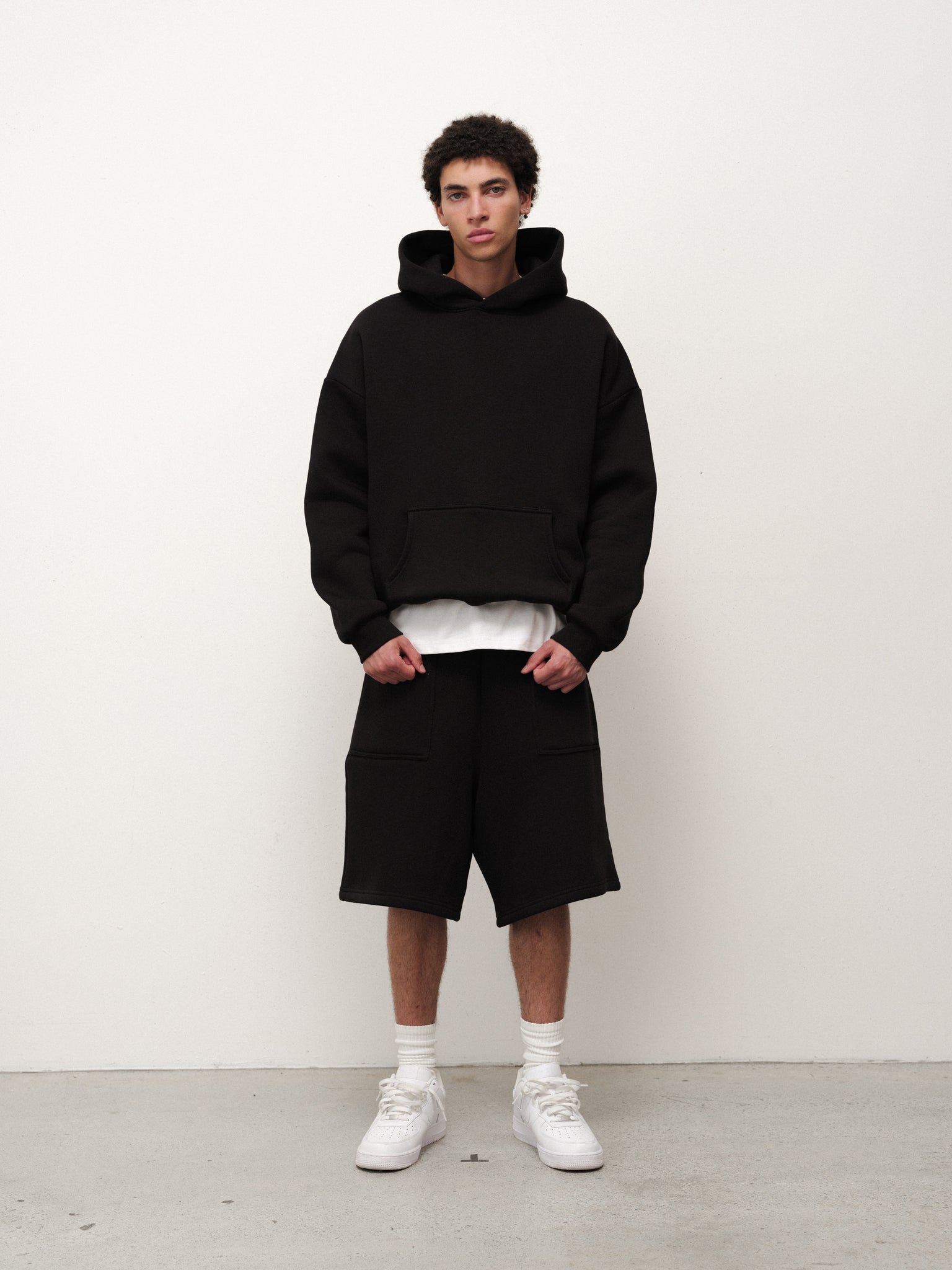 Black Cozy Shorts by Sweats EU, soft and comfortable loungewear shorts shown on a model.