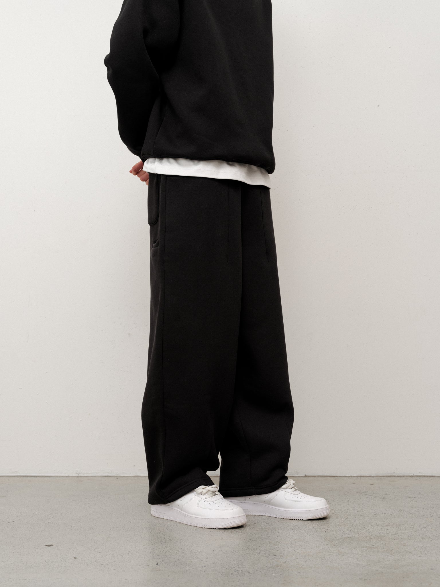 Black cozy straight leg sweats from Sweats EU, featuring a relaxed fit and soft fabric visible in the image.