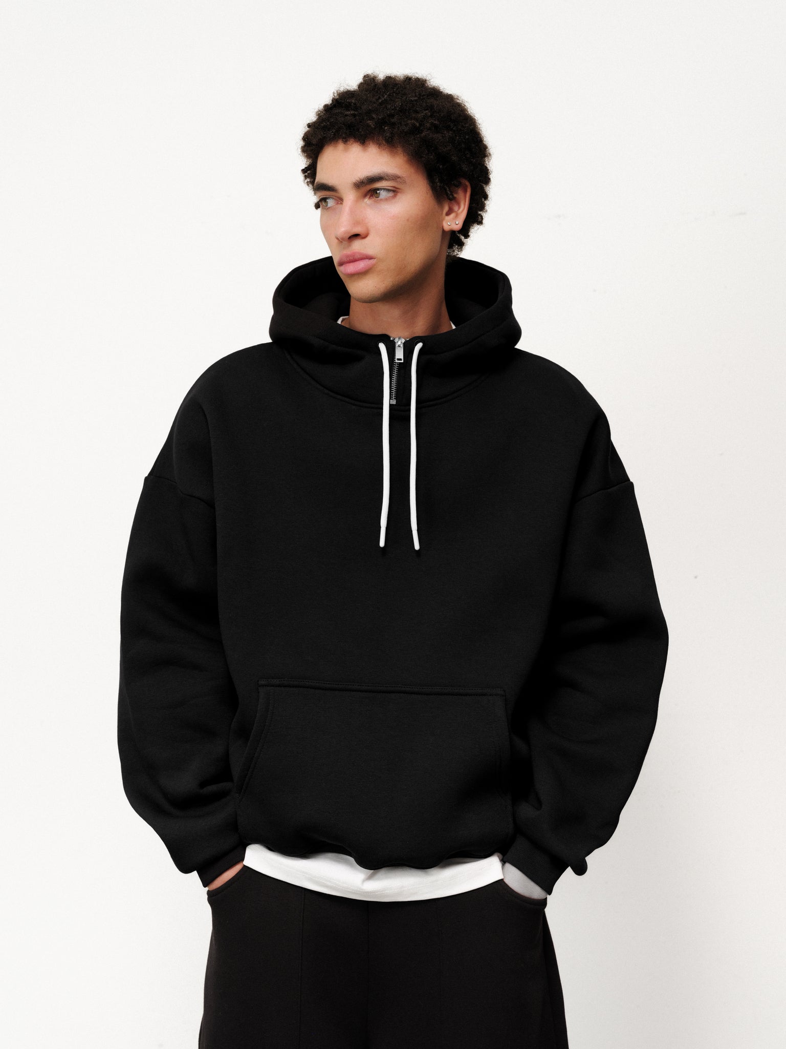 Black Cozy Tech Hoodie by SWEATS EU, front view showing soft fabric and relaxed fit, ideal for casual wear.