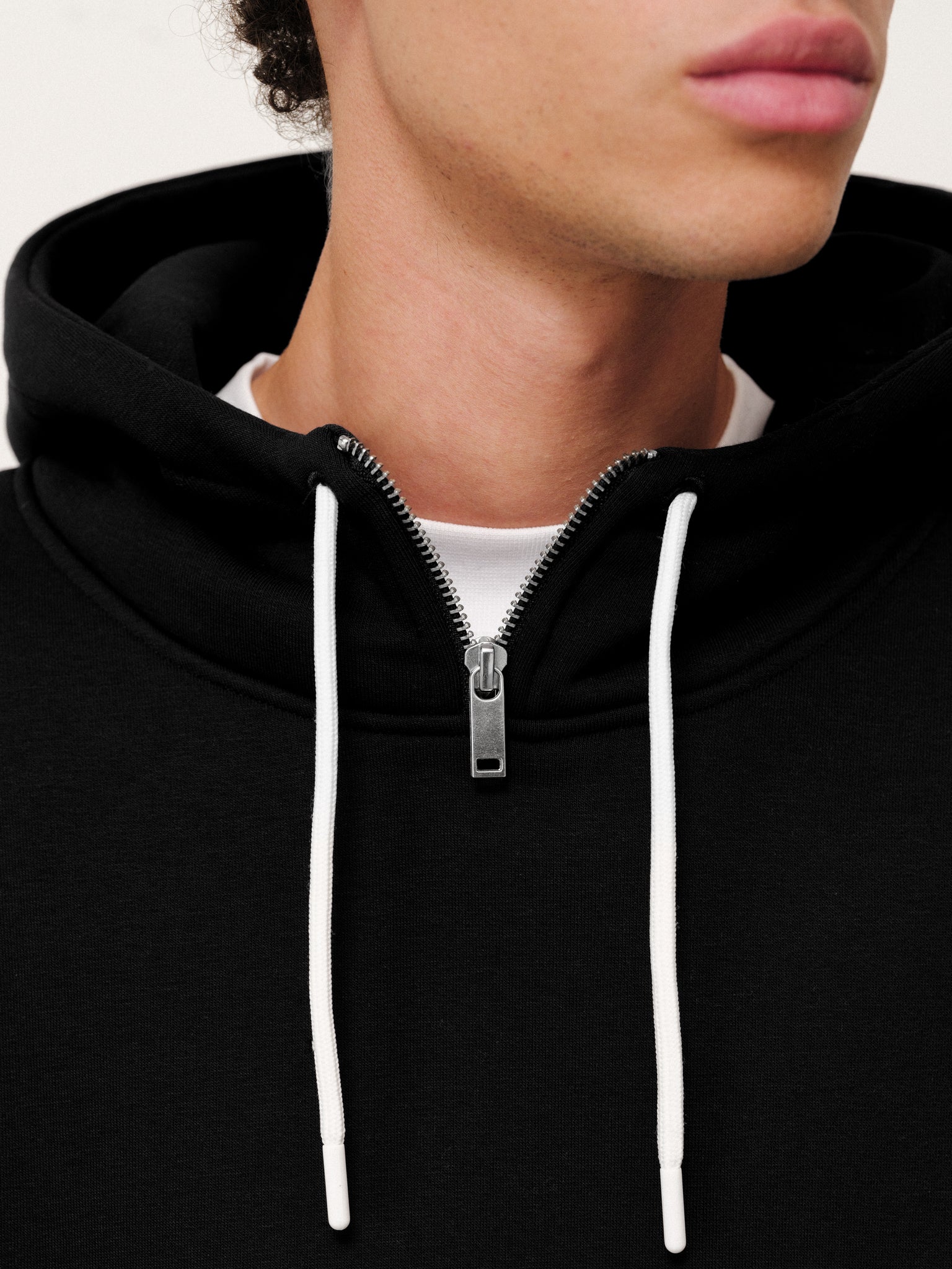 Black Cozy Tech Hoodie by SWEATS EU, showing a comfortable, casual hoodie with a relaxed fit and soft fabric.