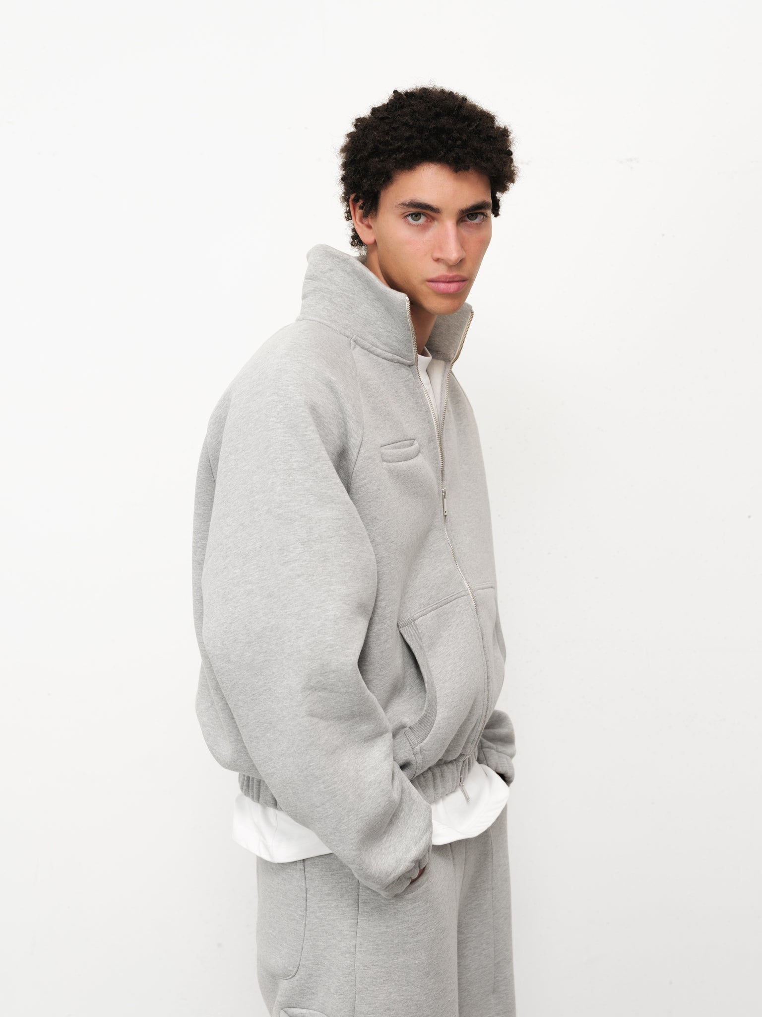 Grey Cozy Track Jacket from Sweats EU with a comfortable fit and stylish design, shown on a model.