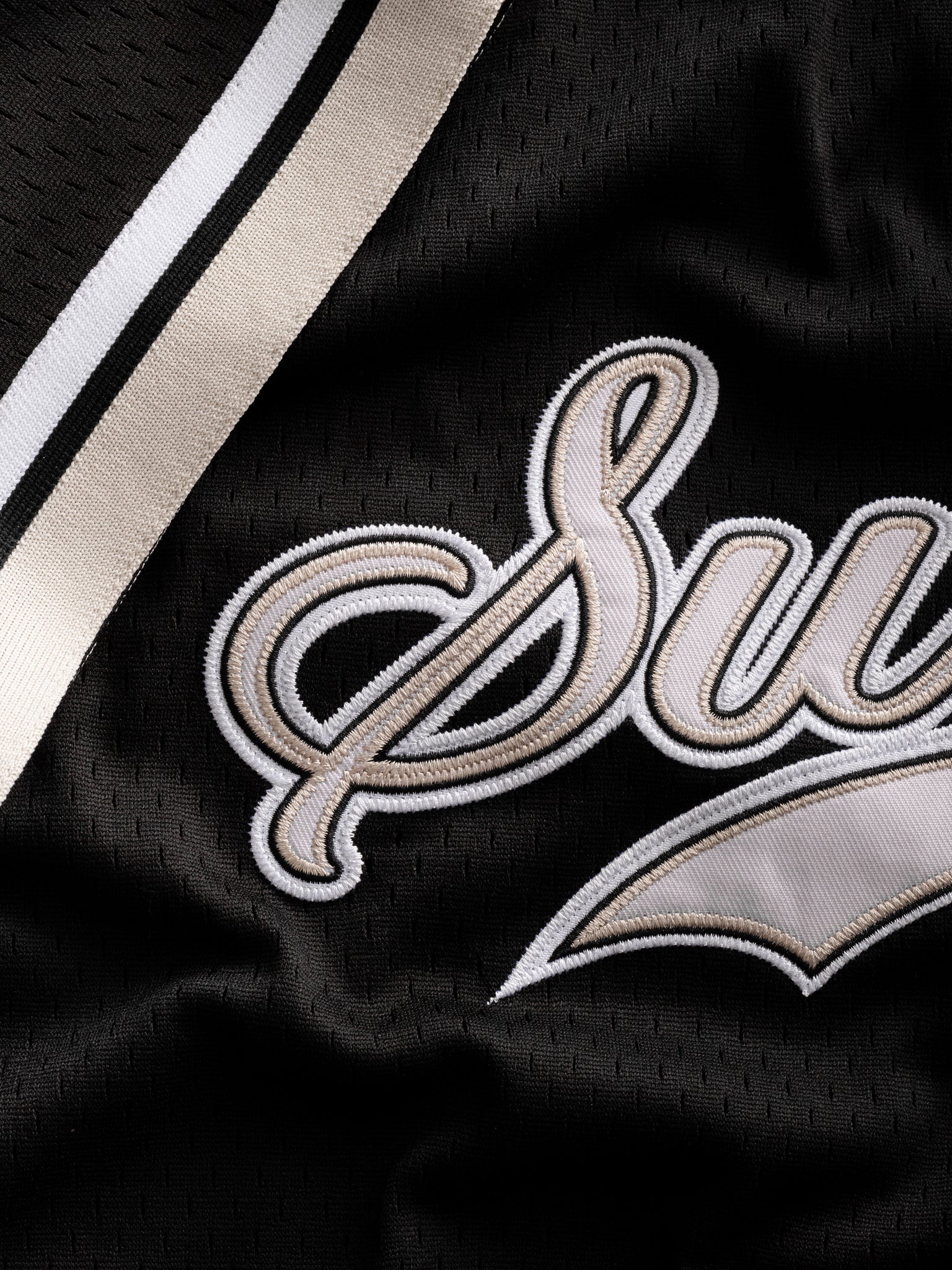Black baseball jersey by SWEATS EU displayed flat with front view, showing its casual design and sporty style.