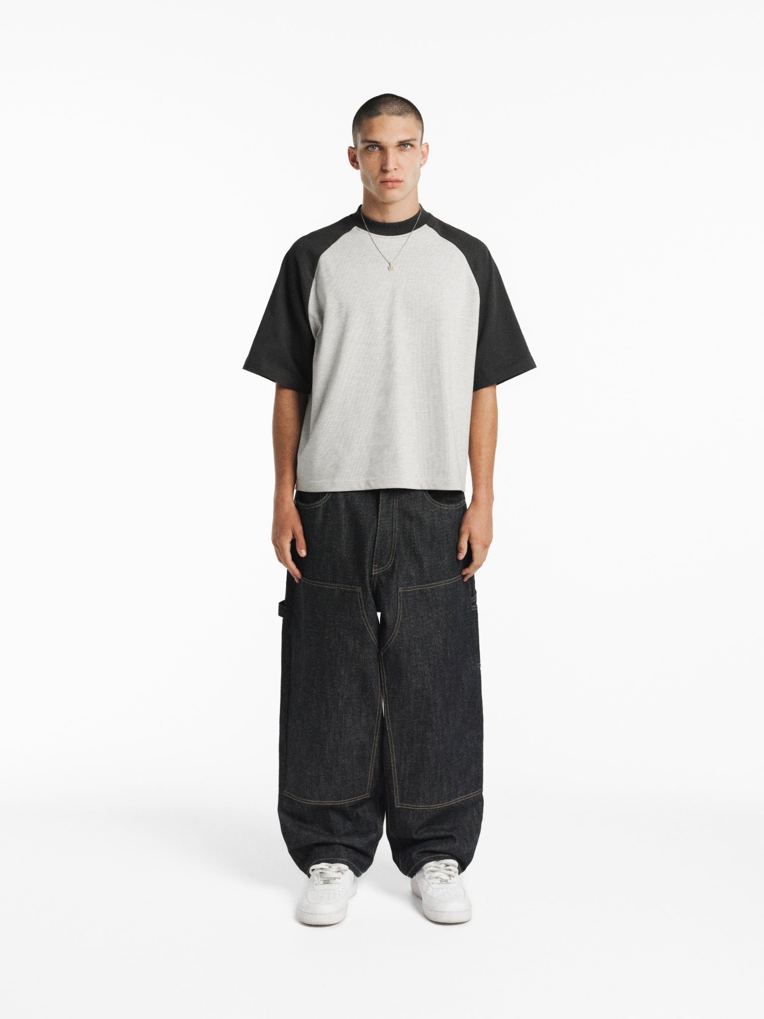 SWEATS EU raglan short sleeve T-shirt in Arctic and Granite colors, shown on a model with a casual fit and modern style.