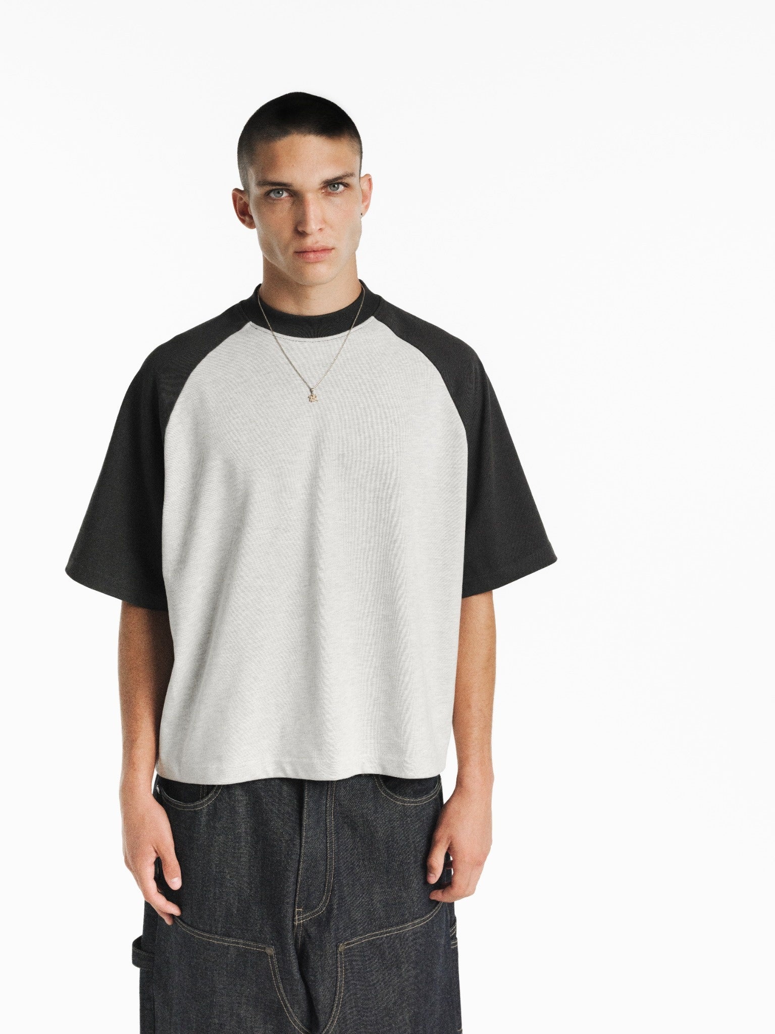 SWEATS EU raglan SS T-shirt in arctic blue and granite color, displayed on a model with casual styling.