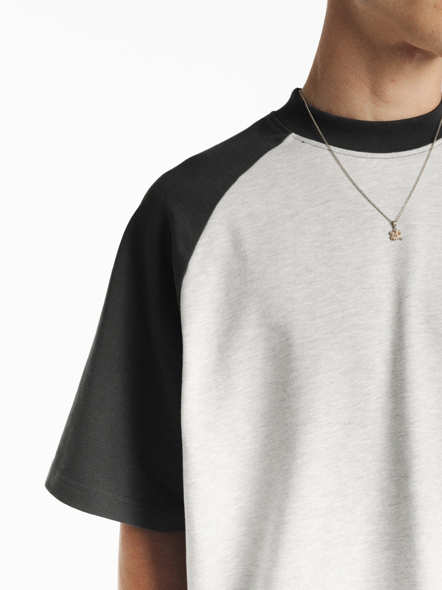 Light blue and gray raglan short-sleeve T-shirt from SWEATS EU featuring a casual fit and classic crew neckline.
