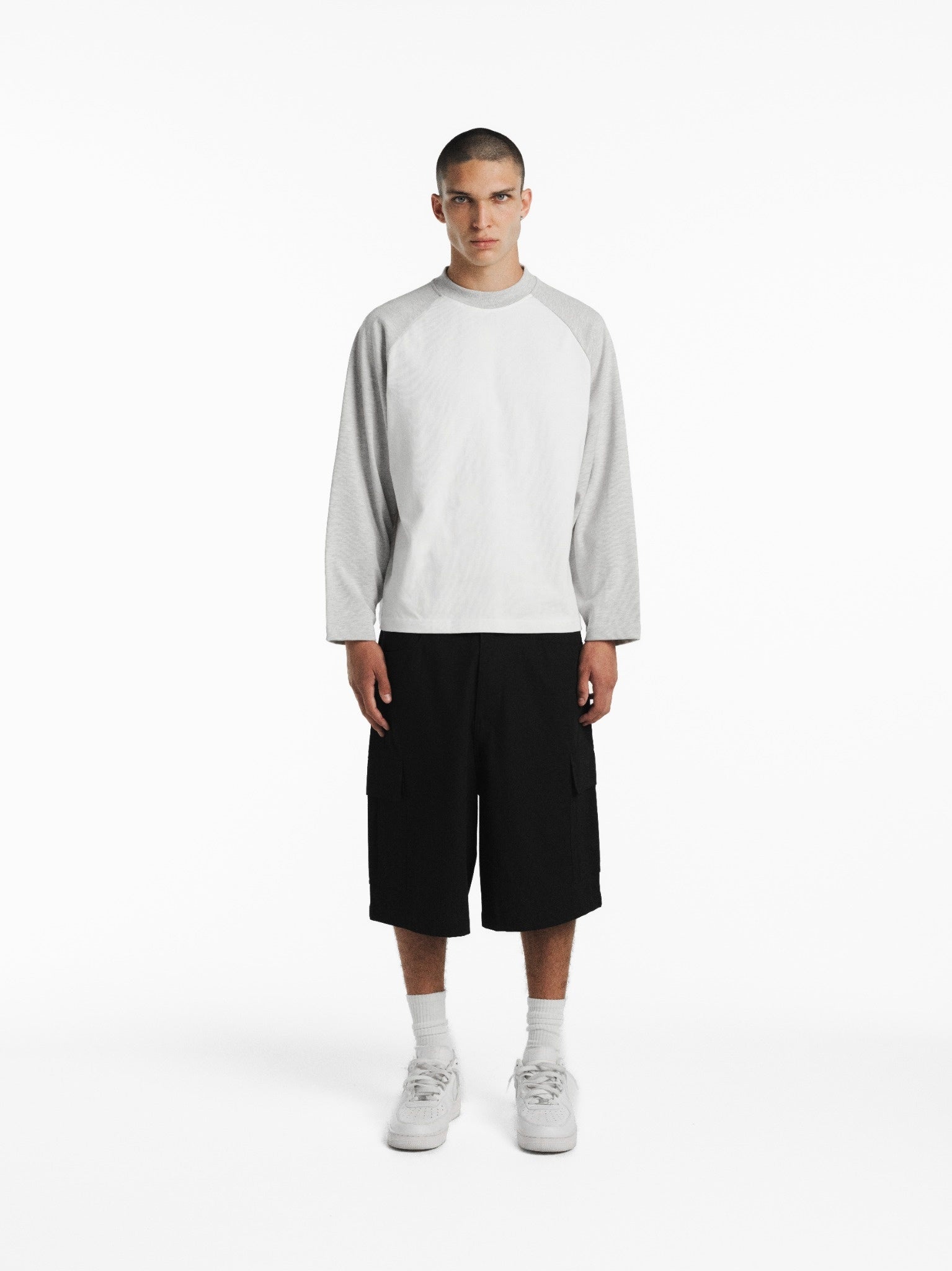 White and Arctic blue raglan long-sleeve T-shirt by SWEATS EU, shown on a model with a casual fit and modern style.