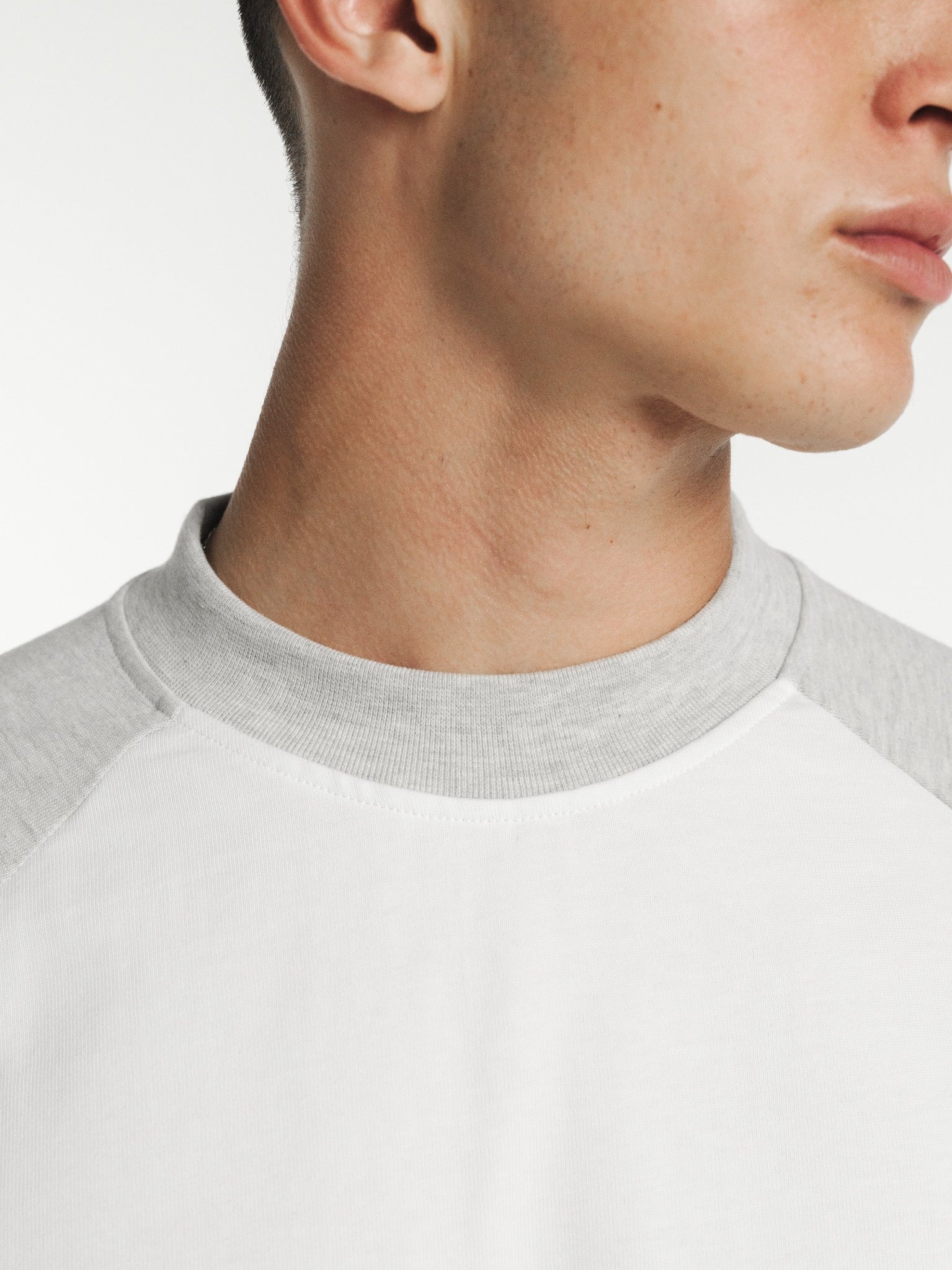White and Arctic raglan long-sleeve T-shirt from SWEATS EU featuring contrasting color sleeves and a casual fit.