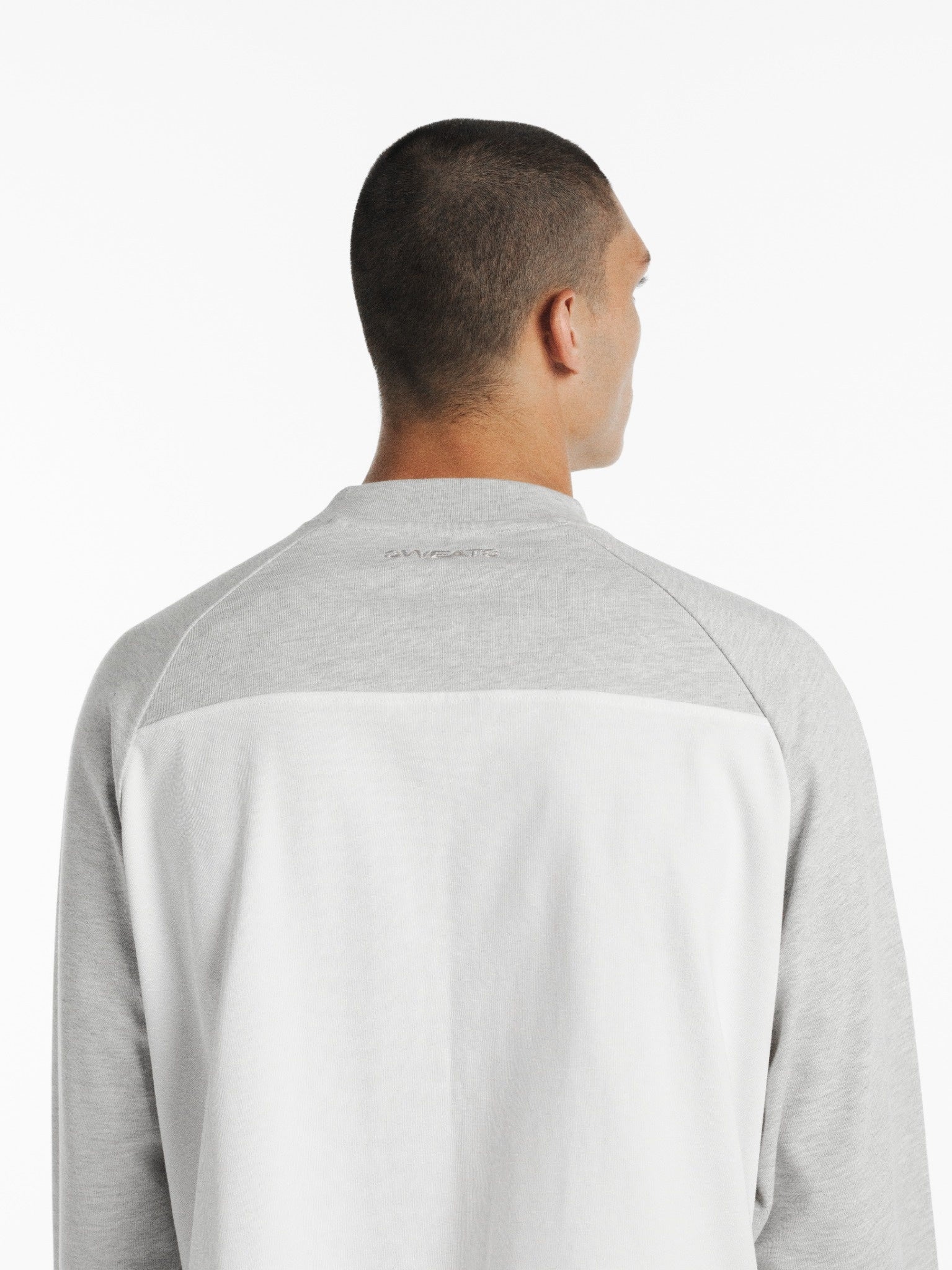 White and Arctic blue raglan long sleeve T-shirt by SWEATS EU, featuring contrasting color sleeves and a casual fit.