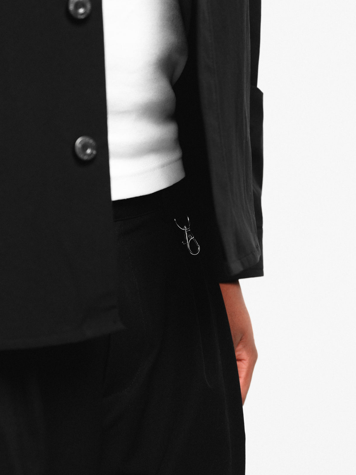 Black pleated shorts by Sweats EU, featuring a stylish design with pleats and a comfortable fit.
