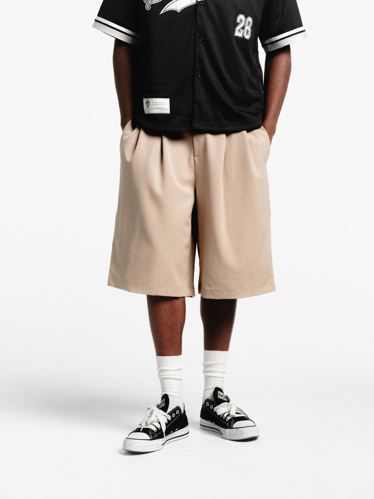Sand-colored pleated shorts by Sweats EU, featuring a relaxed fit and stylish pleats, perfect for casual summer wear.