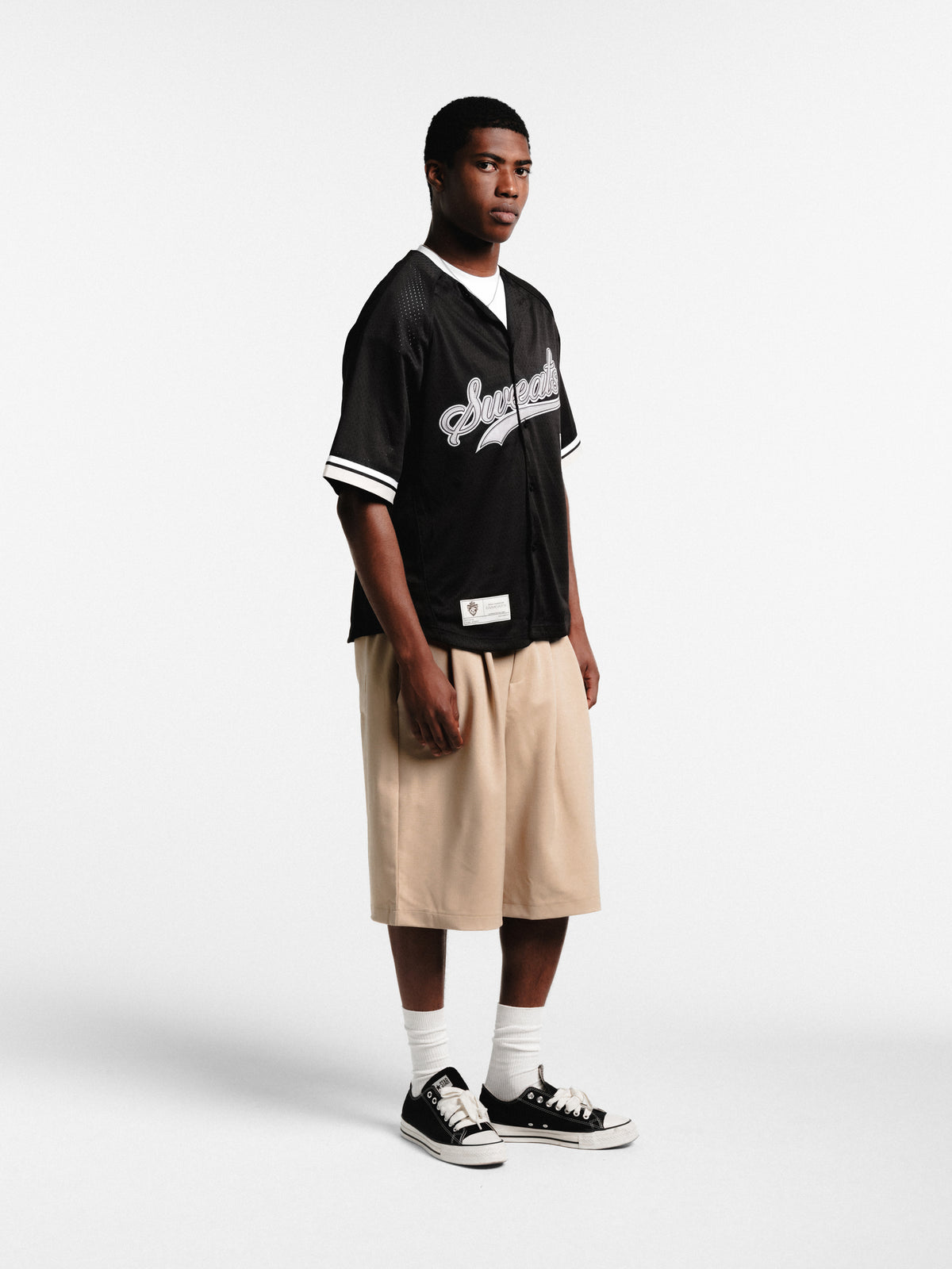 Sand-colored pleated shorts by Sweats EU featuring a relaxed fit and stylish pleats, perfect for casual summer wear.