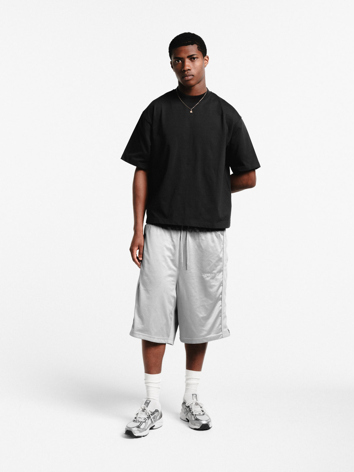Grey mesh shorts by SWEATS EU, featuring lightweight fabric and a comfortable fit, shown on a plain background.