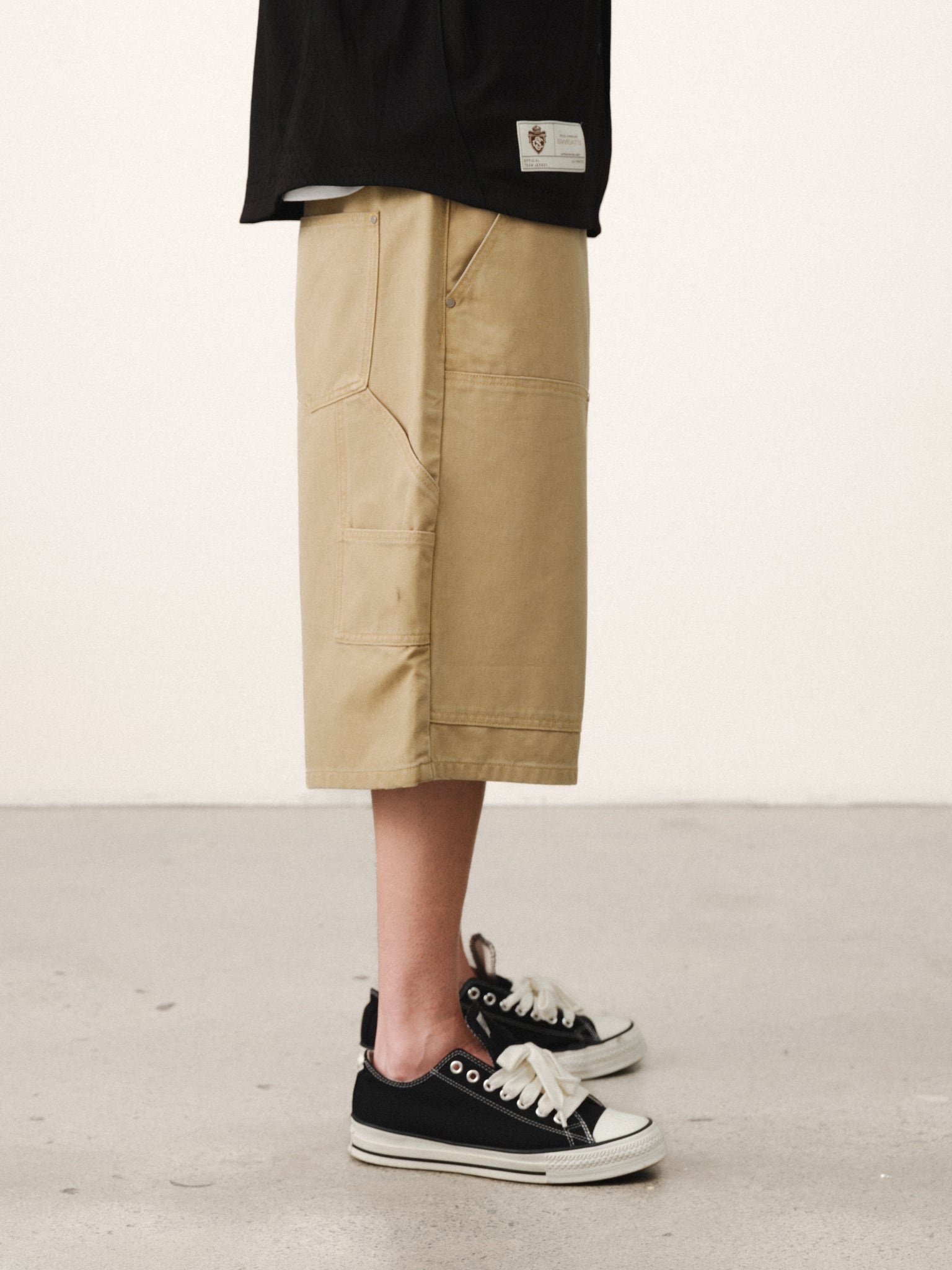 Pair of double knee shorts in sand color by SWEATS EU, showing the relaxed fit and rugged design suitable for summer casual wear.